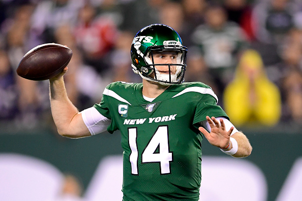 Sam Darnold of the New York Jets attempts a pass against the New England Patriots during the second half at MetLife Stadium in East Rutherford, New Jersey on October 21, 2019.