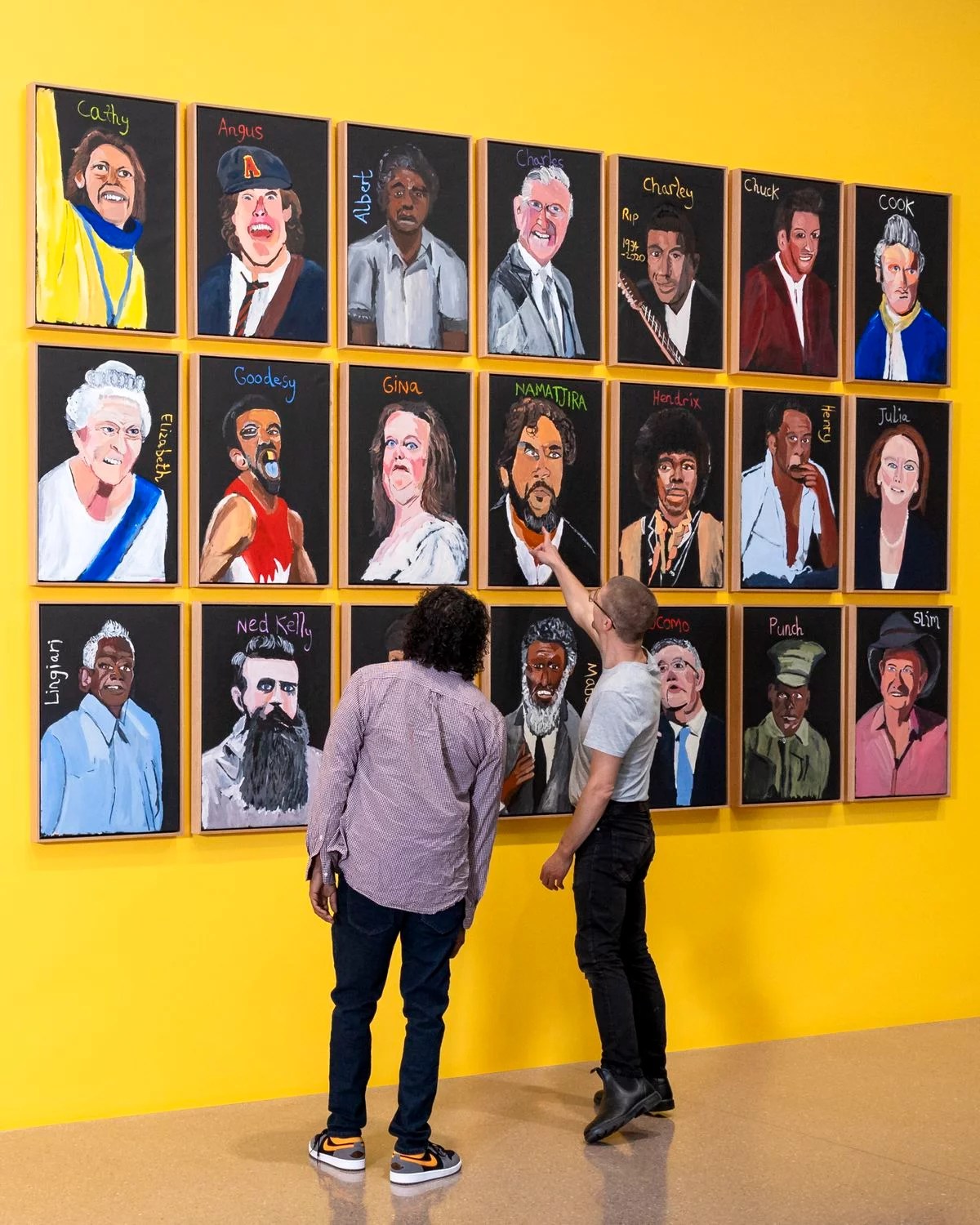 Vincent Namatjira looks at the installation of his exhibition, "Vincent Namatjira: Australia in colour," at the National Gallery of Australia.