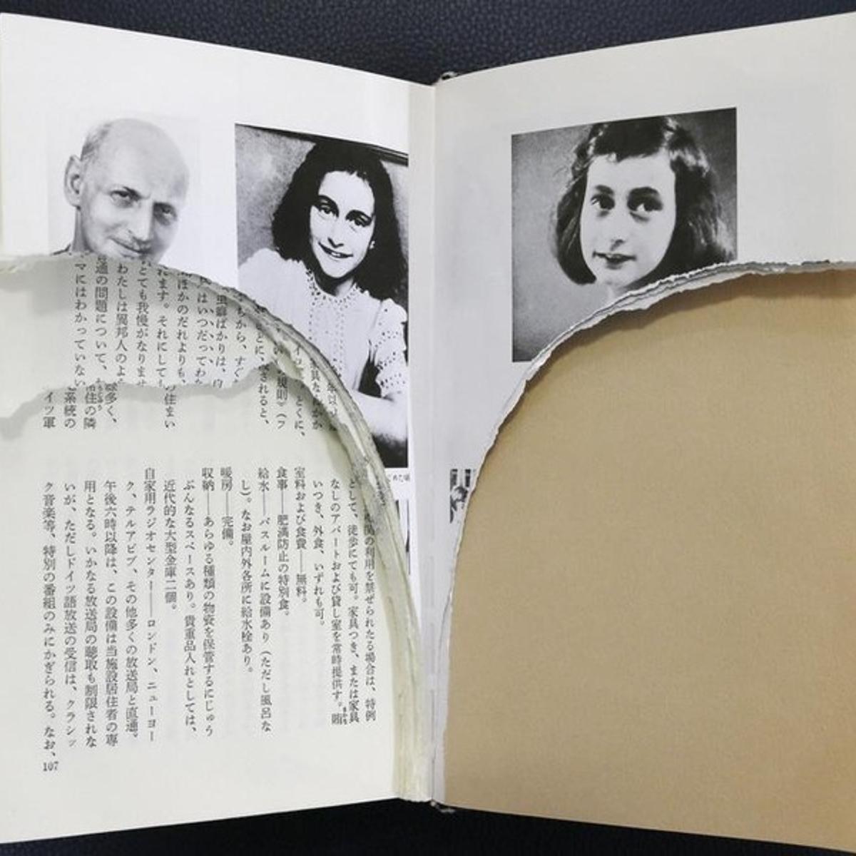 Ripped pages of Anne Frank's "Diary of a Young Girl" are pictured at a library in Tokyo