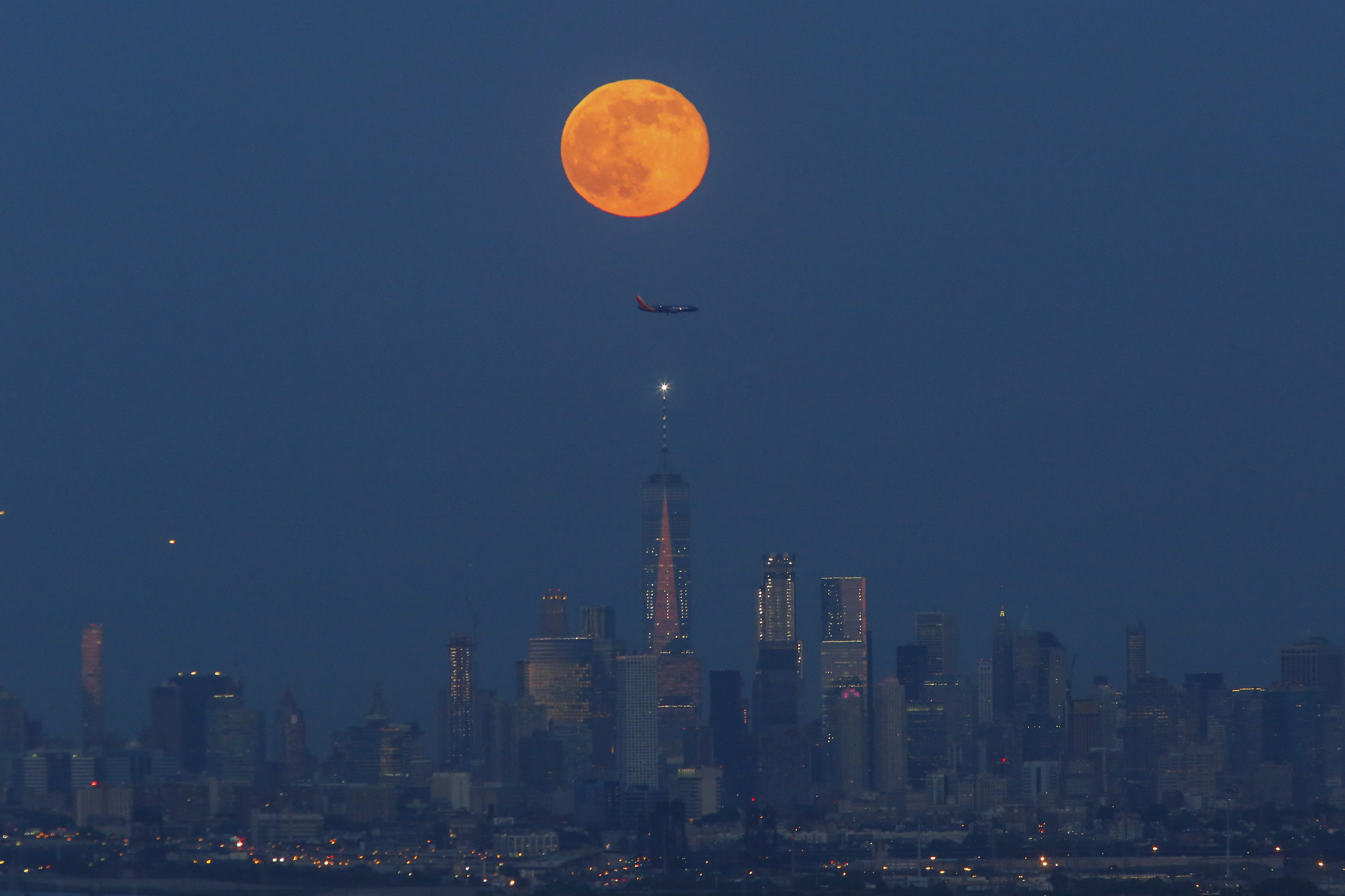 Strawberry Moon rises over New York City