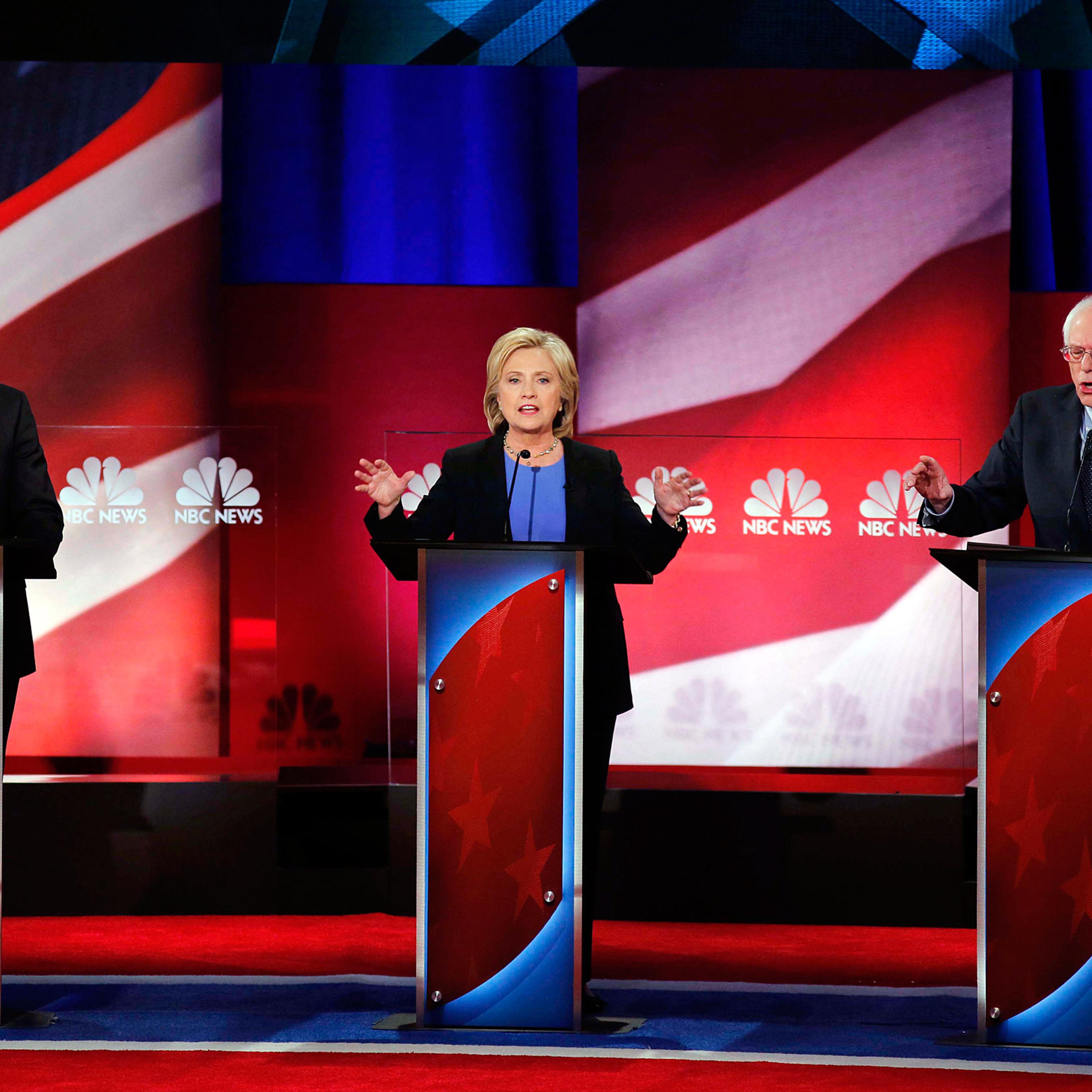 Democratic presidential candidate, Hillary Clinton, center, Democratic presidential candidate, Sen. Bernie Sanders, I-Vt. left, and Democratic presidential candidate, former Maryland Gov. Martin O'Malley, right, seems to speaks at the same time, during t