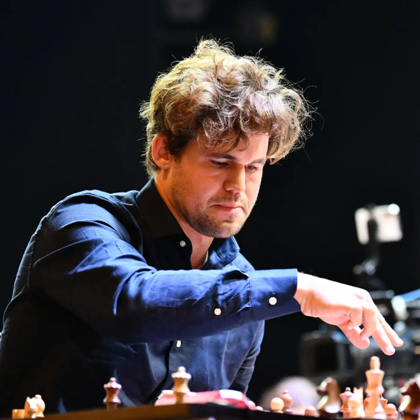 Norwegian Grandmaster Magnus Carlsen plays chess during the