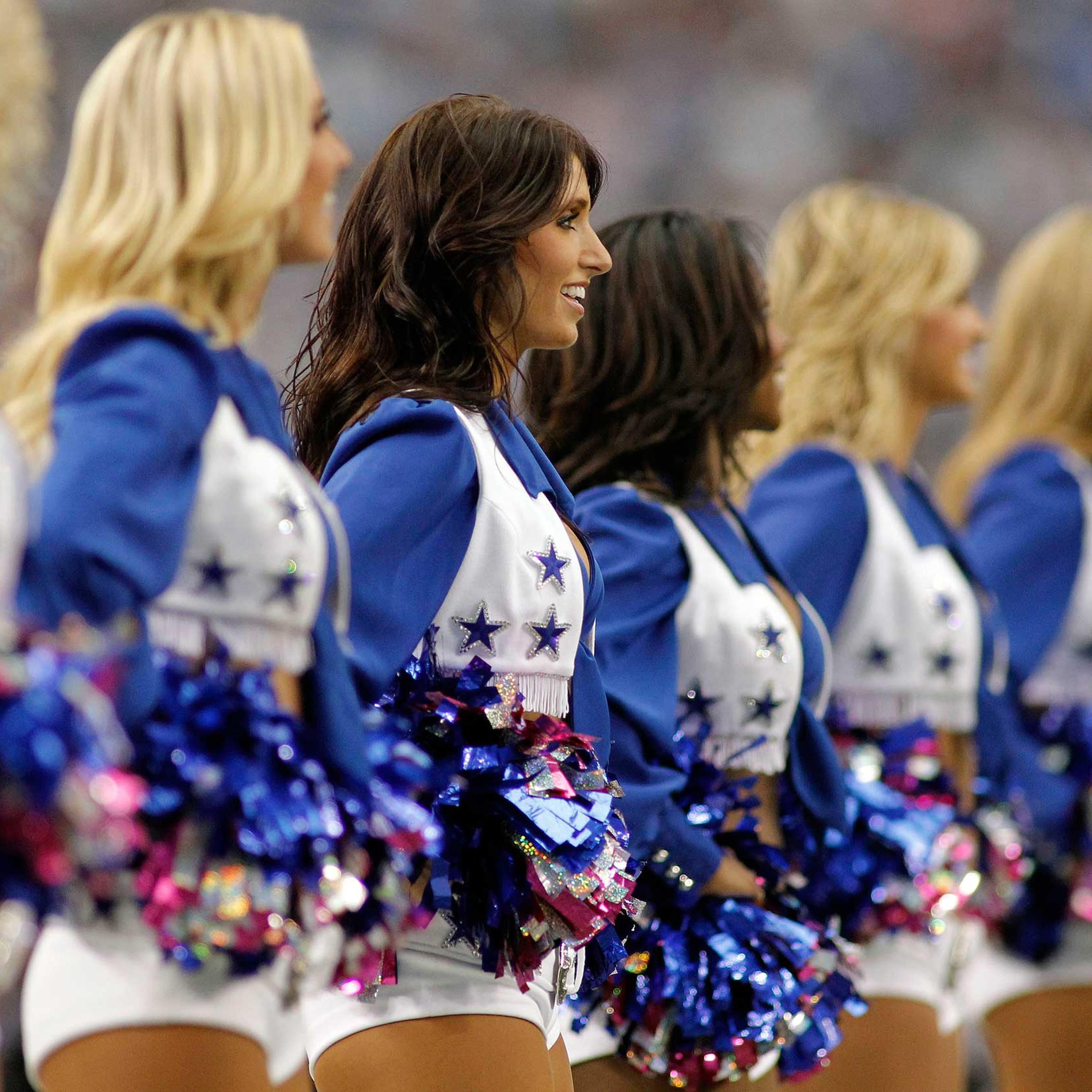 The Dallas Cowboys cheerleaders perform during the game between the Cowboys and Detroit Lions at Cowboys Stadium in Arlington, Texas.