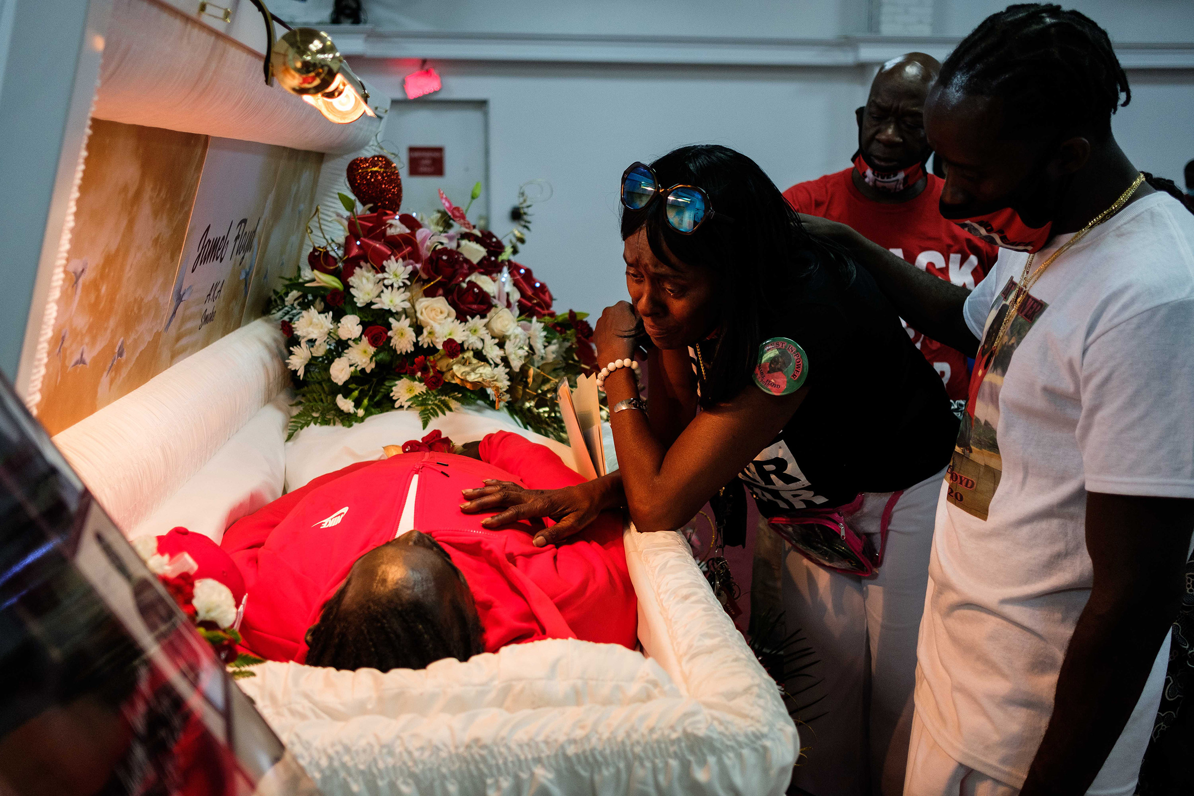 Donna Mays, Jamel Floyd’s mother, looks down at her son’s body during the wake at Judea United Baptist Church in Hempstead, N.Y., on June 29.