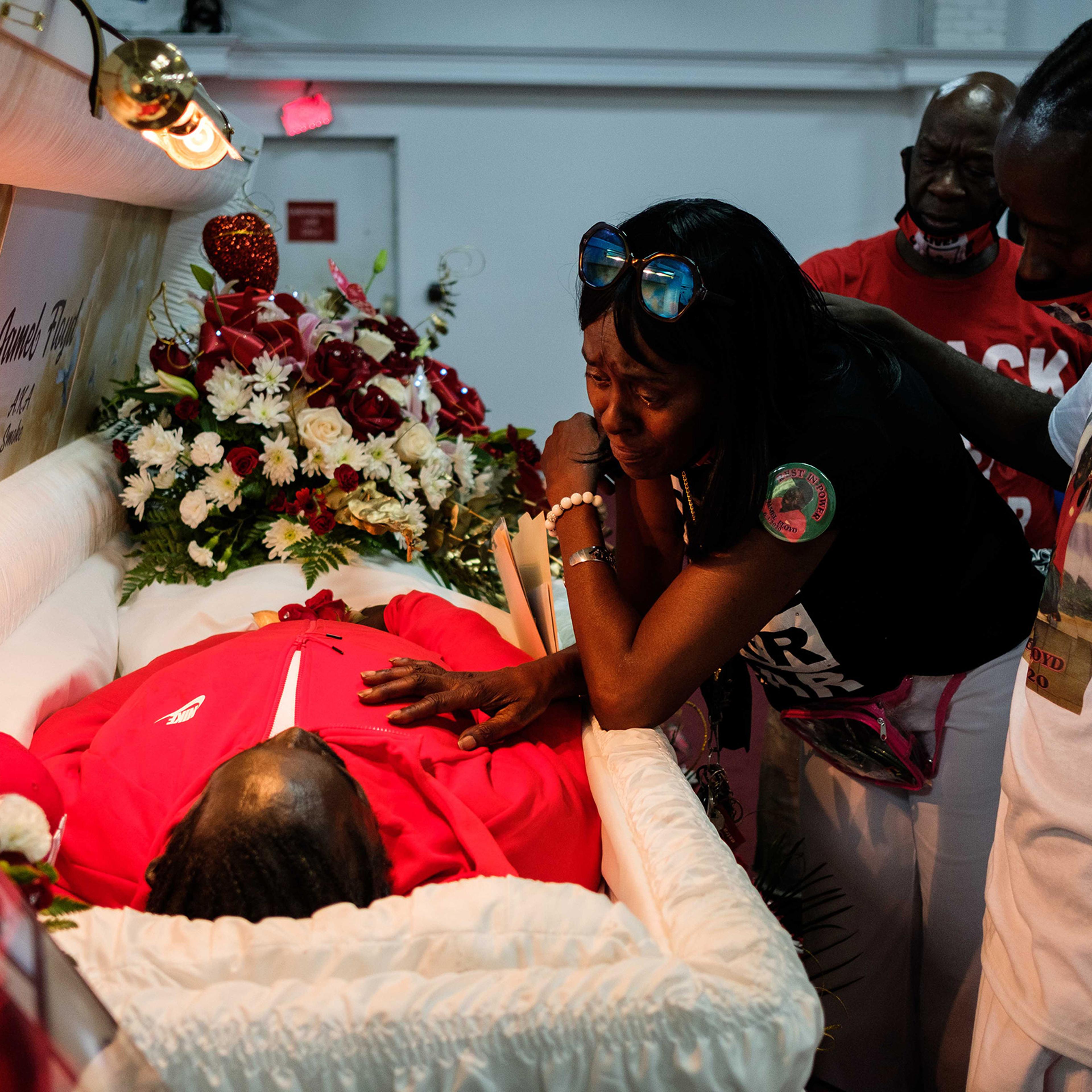 Donna Mays, Jamel Floyd’s mother, looks down at her son’s body during the wake at Judea United Baptist Church in Hempstead, N.Y., on June 29.