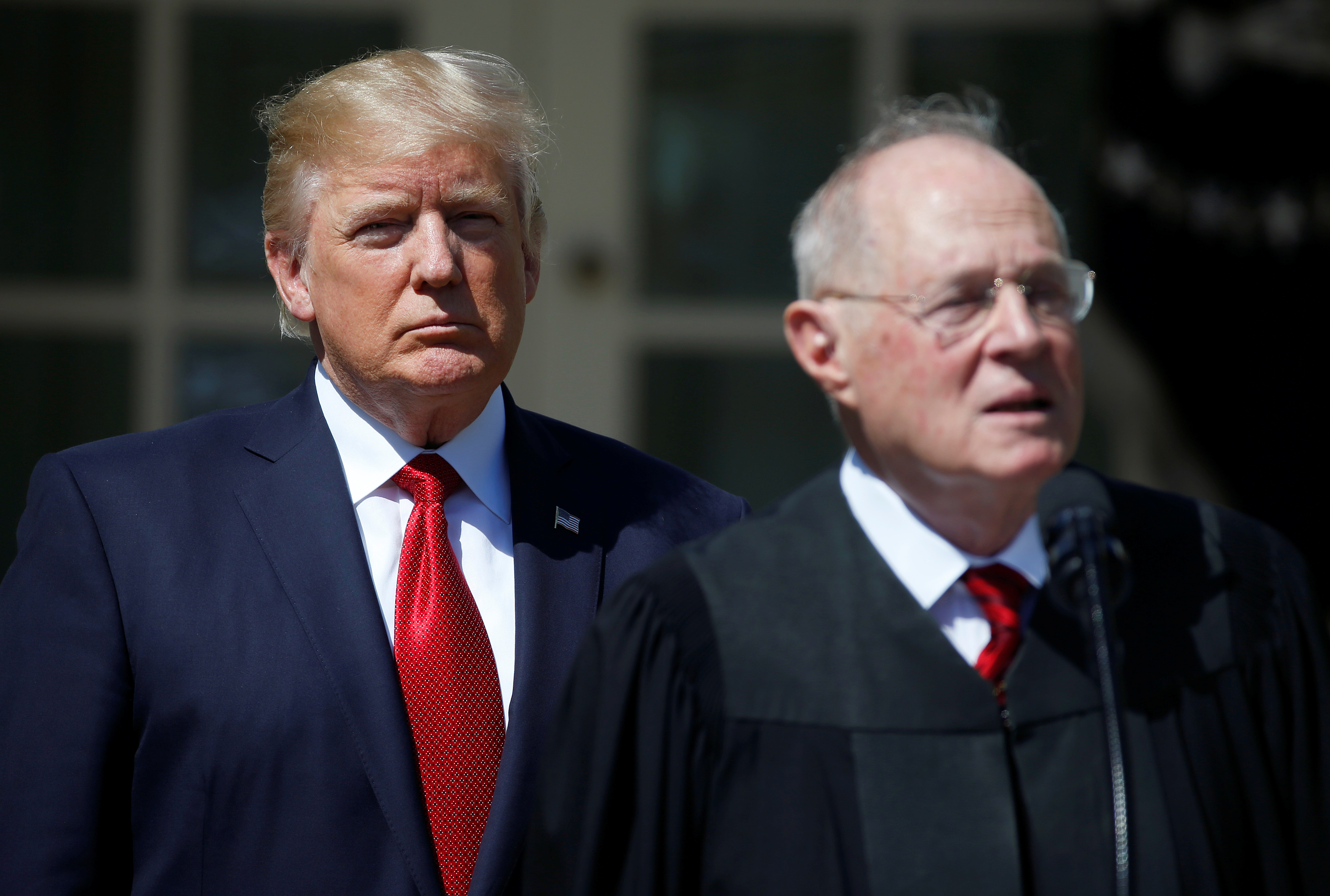U.S. President Donald Trump listens as Justice Anthony Kennedy speaks before swearing in Judge Neil Gorsuch as an Associate Supreme Court Justice in the Rose Garden of the White House in Washington