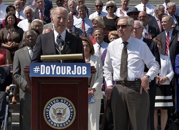 US Vice President Joe Biden speaks during an event with House and Senate Democrats to urge Republican lawmakers to take action on unfinished issues, as Senate Minority Leader Harry Reid (R), D-NV, watches on September 8, 2016 at the East Front steps of t
