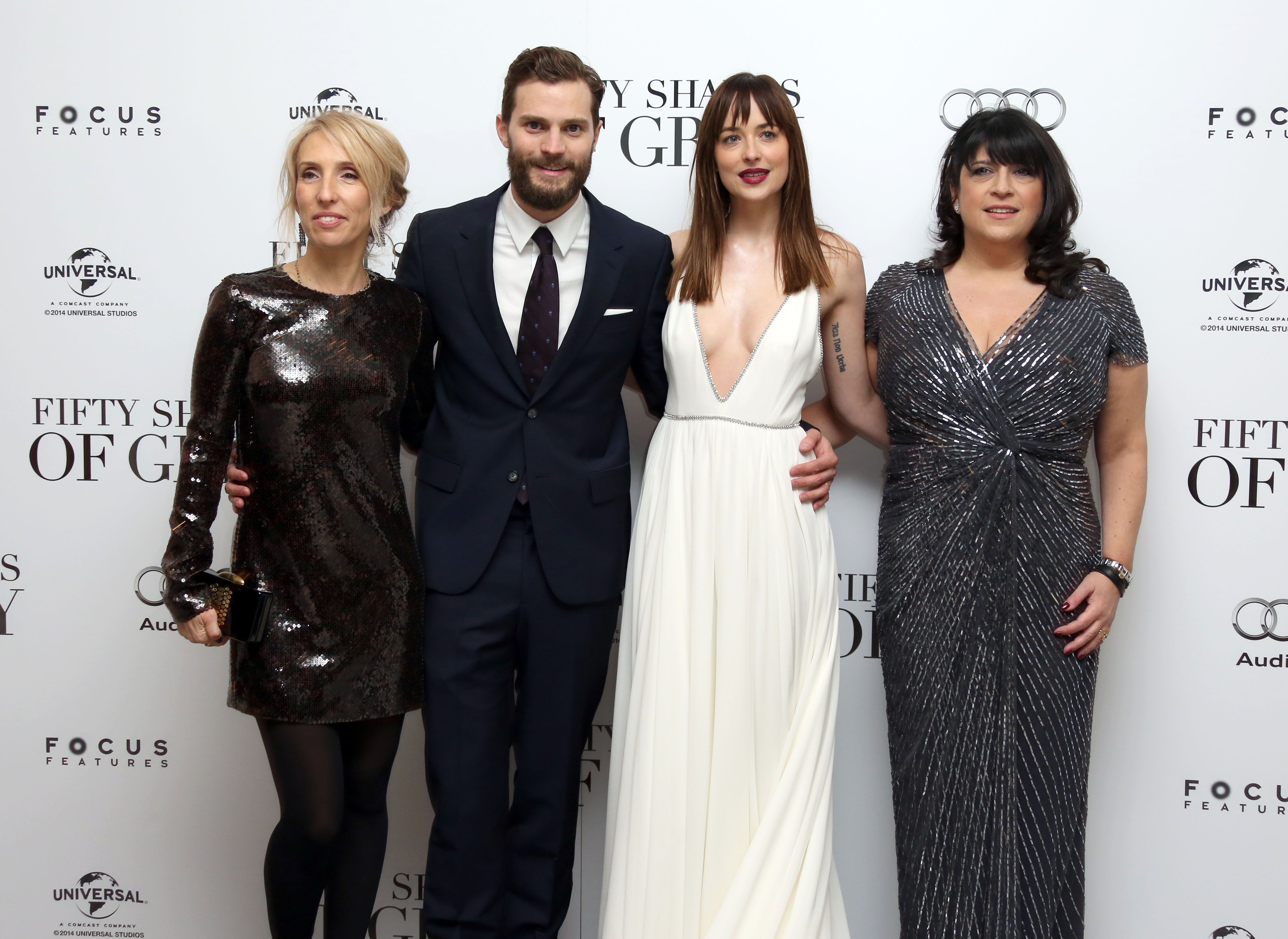 Sam Taylor-Johnson, Jamie Dornan, Dakota Johnson and E.L. James pose for photographers upon arrival at the UK premiere of the film Fifty Shades of Grey in London, Feb. 12, 2015