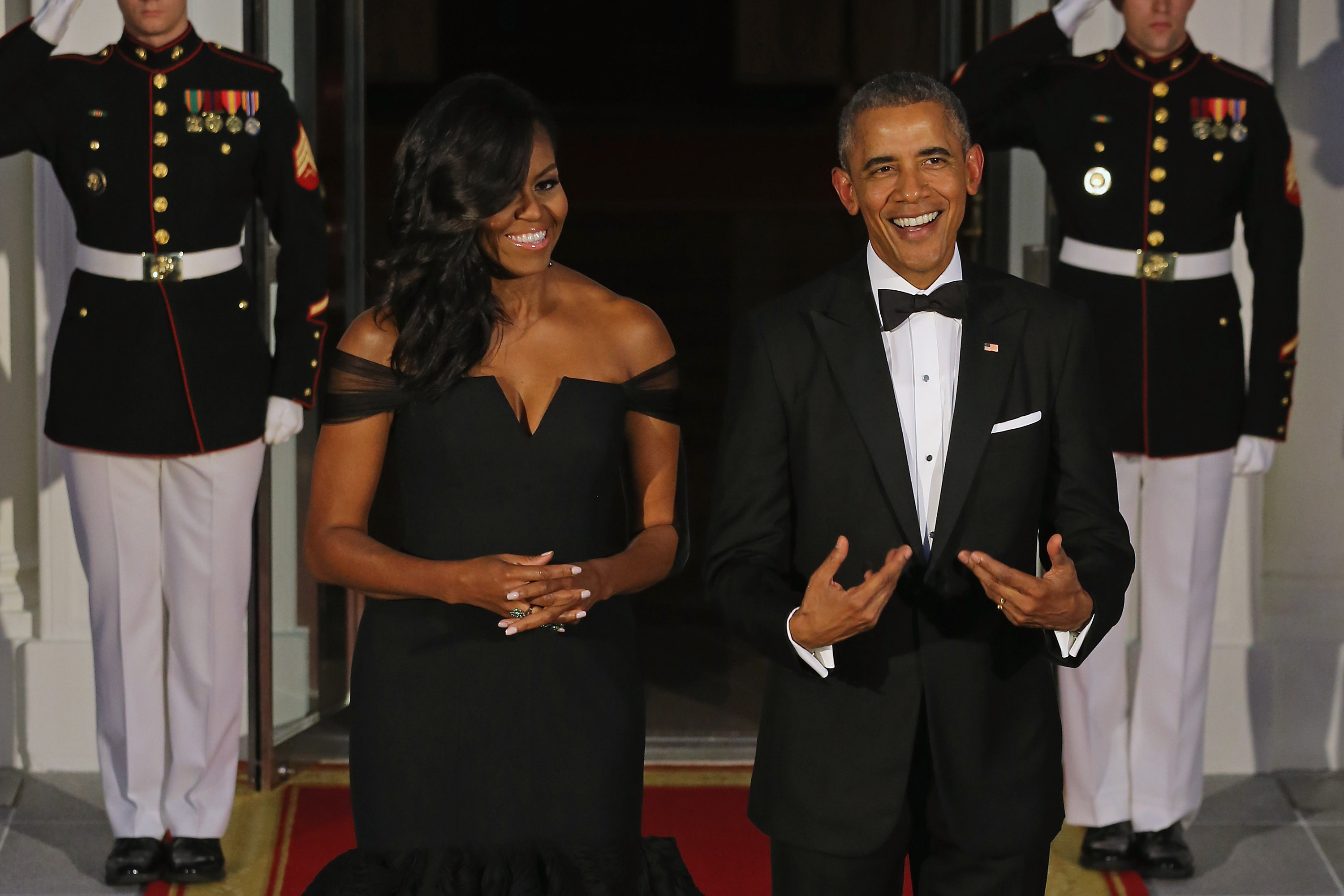 U.S. First Lady Michelle Obama and U.S. President Barack Obama wait on the North Portico for the arrival of Chinese President Xi Jinping and his wife Madame Peng Liyuan ahead of a state dinner at the White House September 25, 2015 in Washington, DC.
