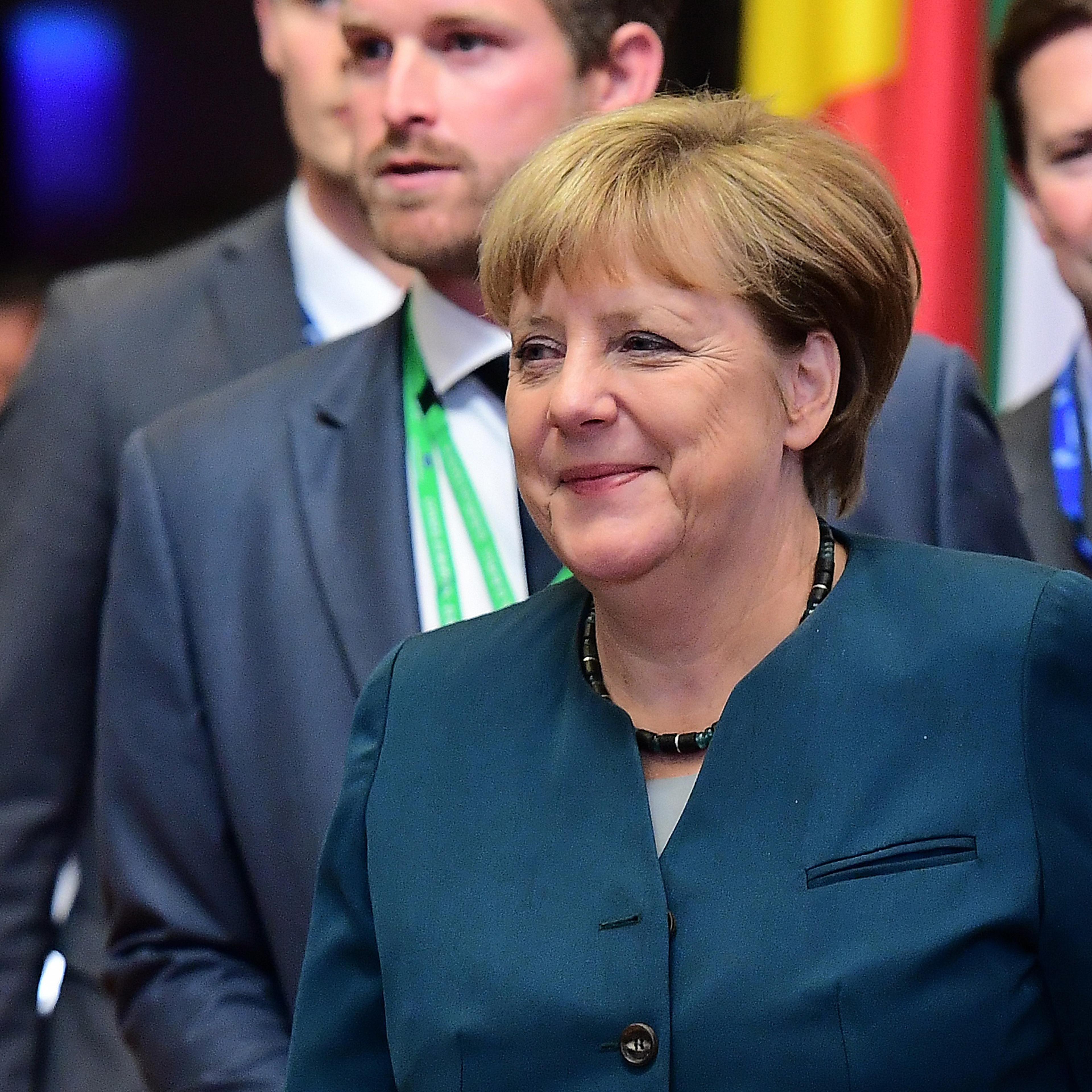 German Chancellor Angela Merkel looks on as she leaves the European Union leaders summit on October 21, 2016 at the European Council, in Brussels.