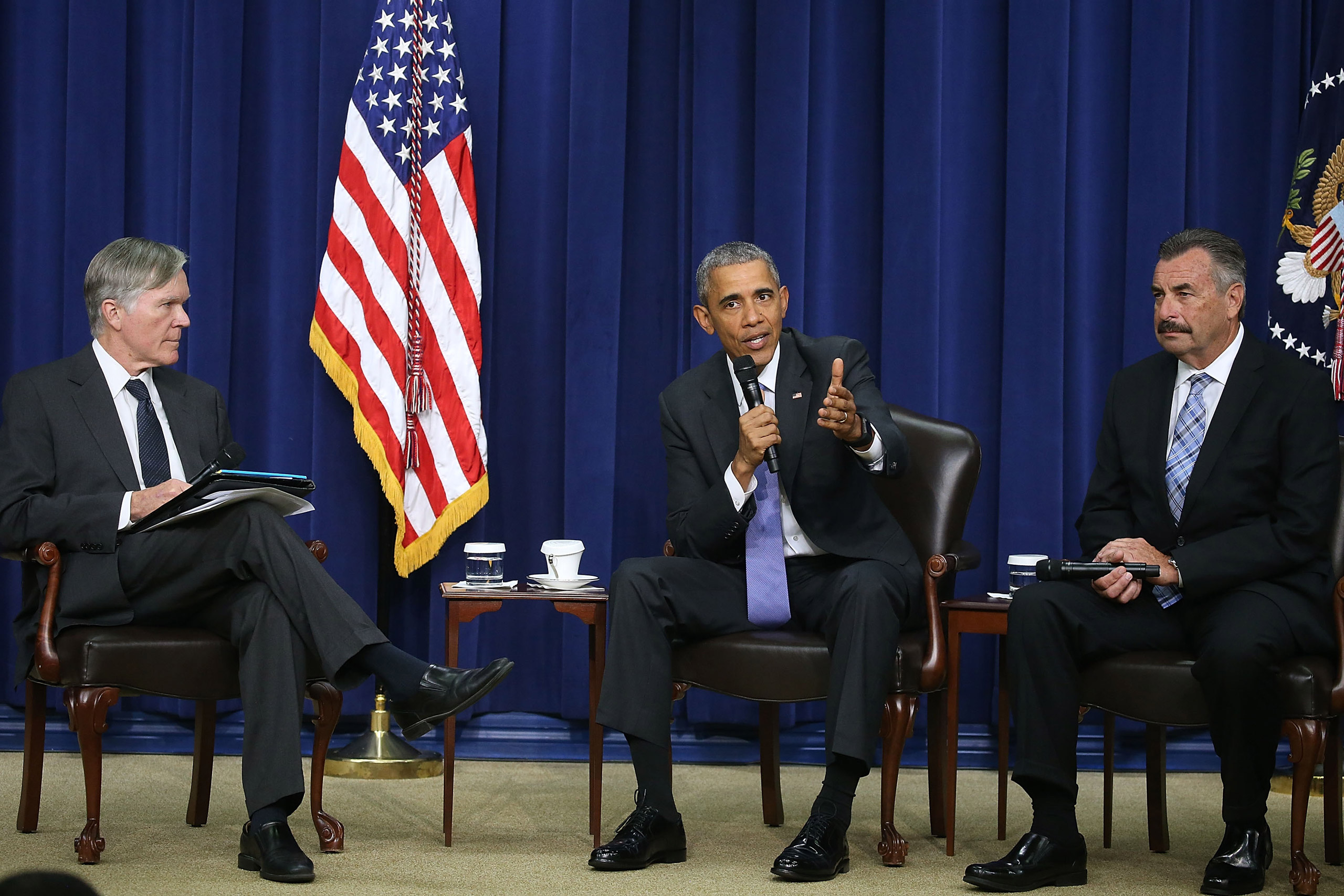 WASHINGTON, DC - OCTOBER 22: U.S. President Barack Obama participates in a conversation on criminal justice reform while flanked by Bill Keller (L) of The Marshall Project, and Charlie Beck (R) of the Los Angleles Police, at the White House October 22, 2