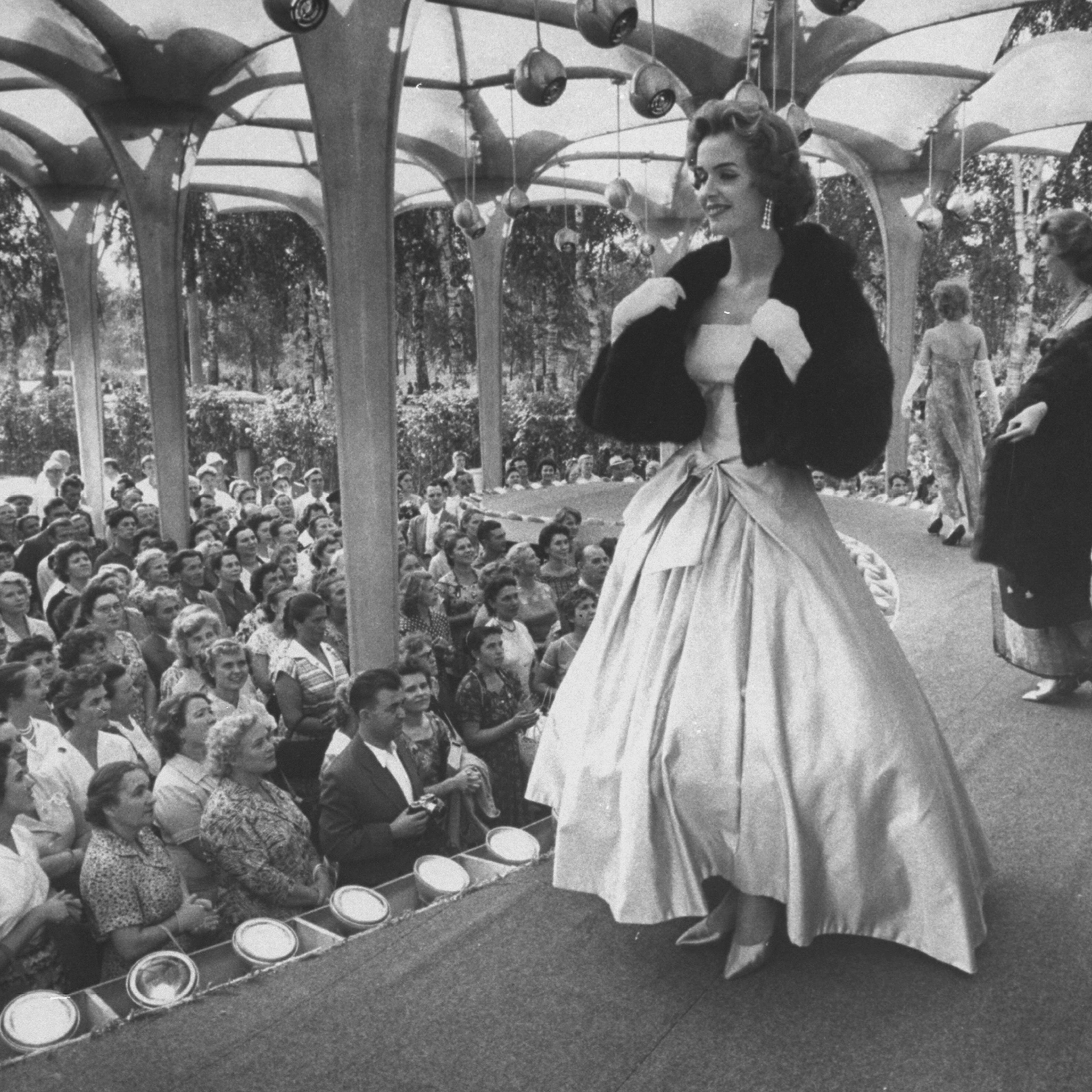 A woman models a gown at a special showing of American fashions in Moscow, 1959
