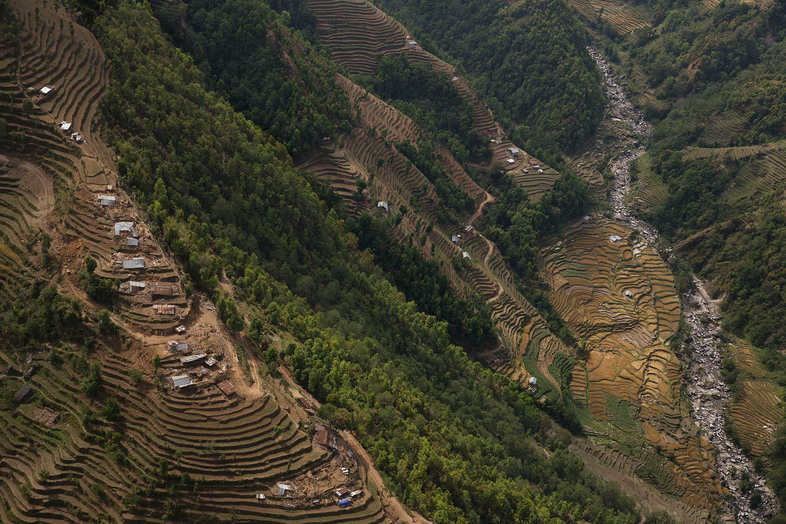 Nepal earthquake. Town of Sankhu. Mush of town was destroyed. People digging out their possessions. Aerial images of Nuwakot district, hit by the earthquake and not able to be reached by aid and rescue teams. Farming villages built atop steep hillsides w