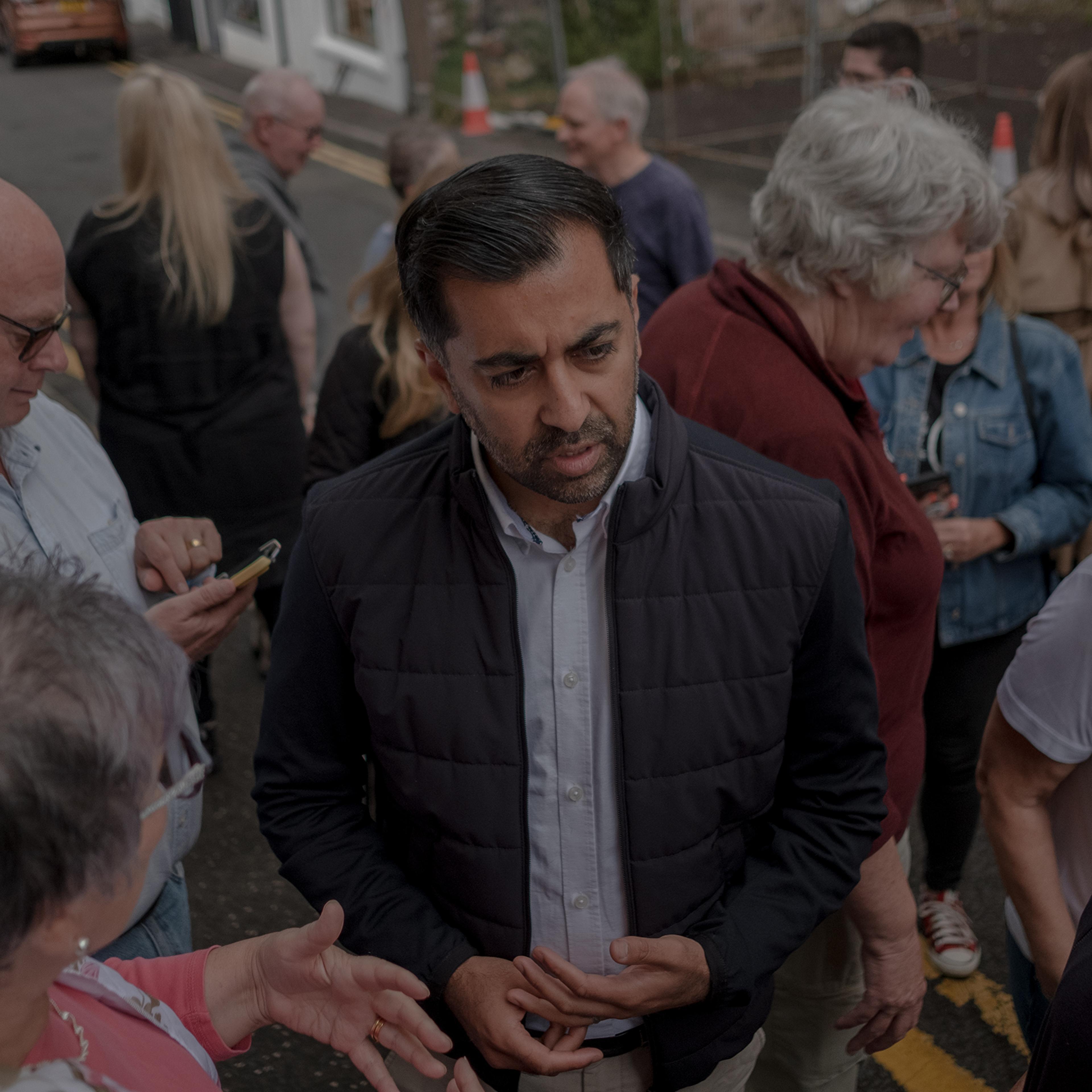 Yousaf speaks to supporters outside the SNP office in Largs, Scotland, on Aug. 23.