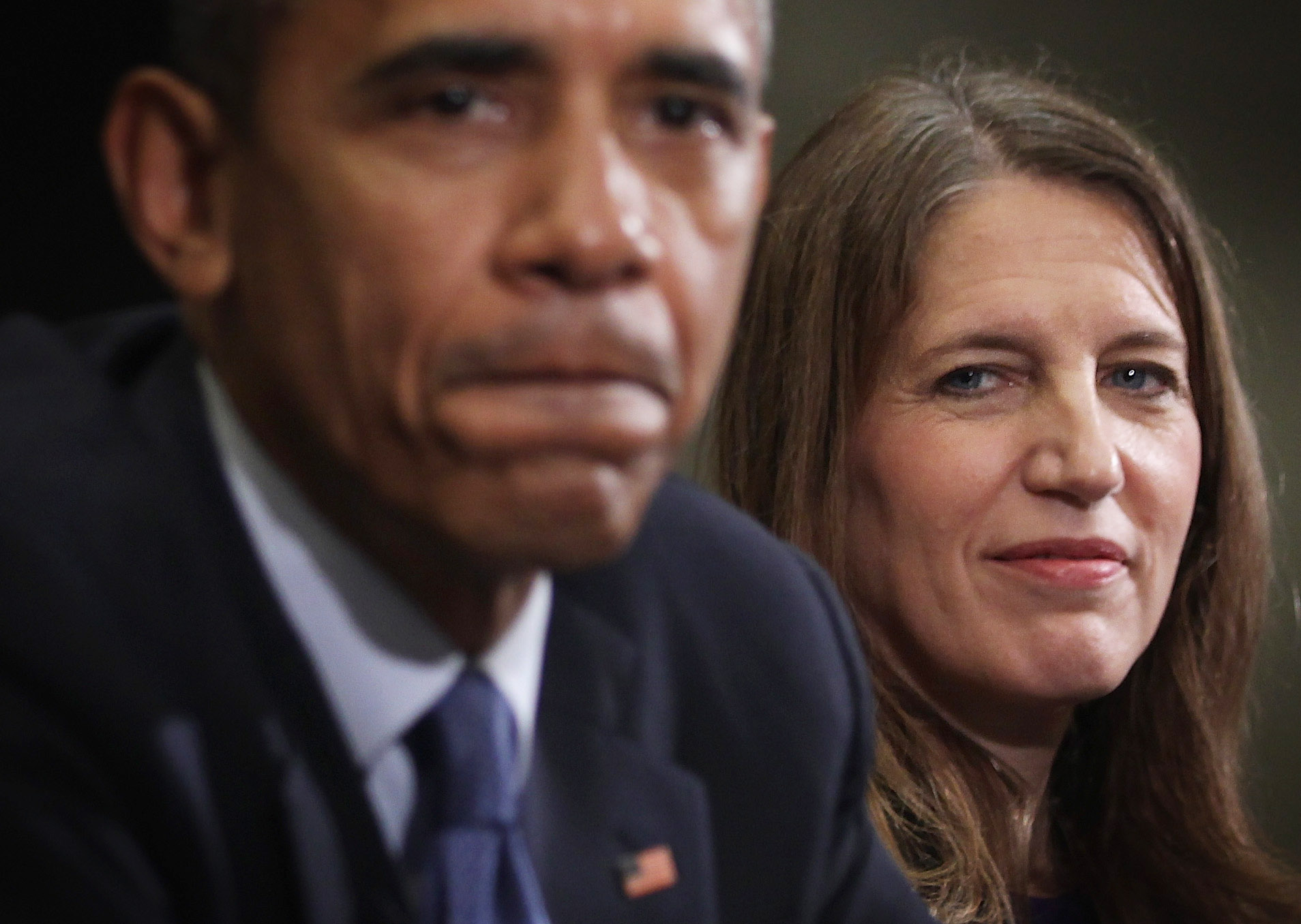 Barack Obama pauses as Secretary of Health and Human Services Sylvia Burwell looks on during a meeting with citizens who wrote letters to him about Affordable Care Act at the White House in Washington, D.C. on Feb. 3, 2015.