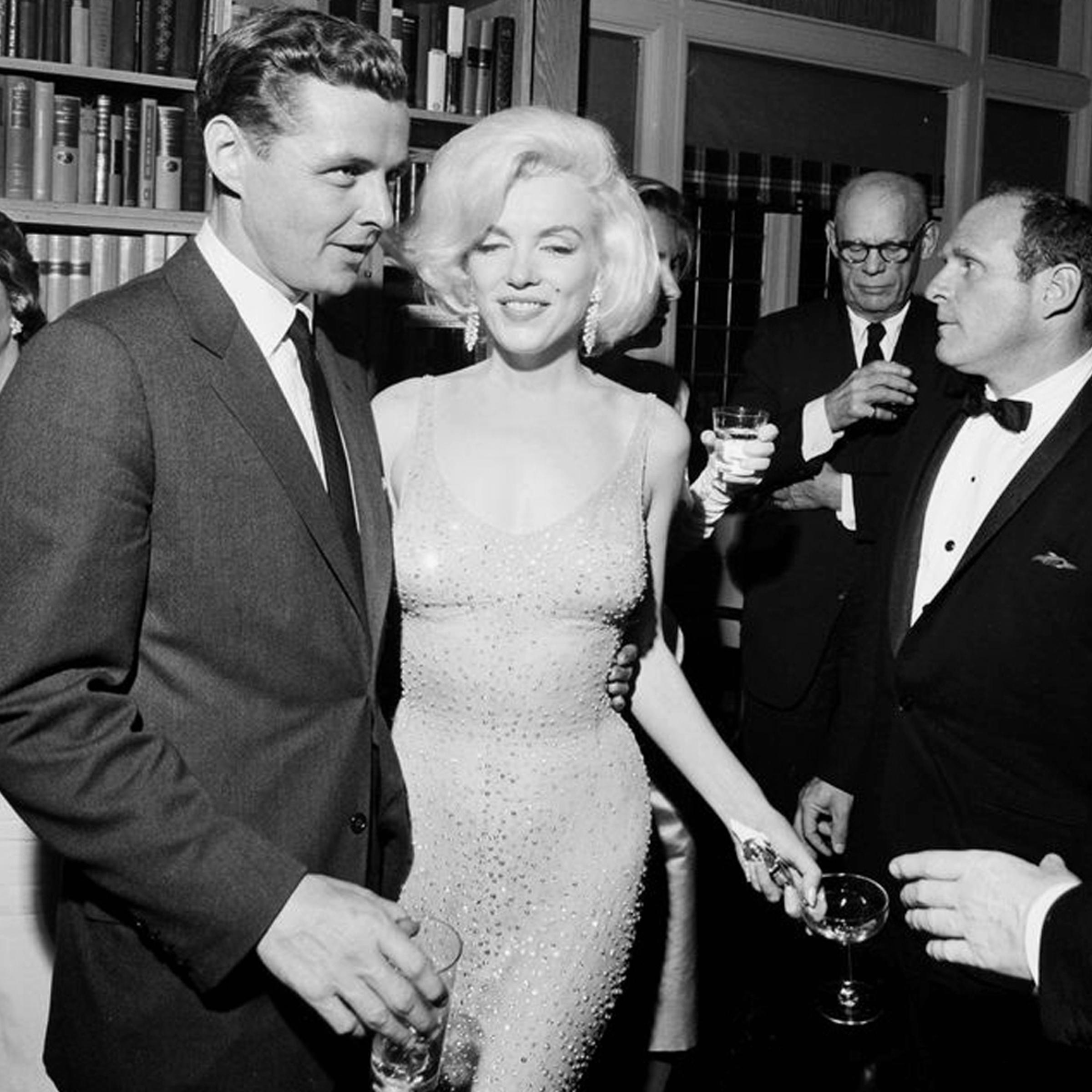 In this May 19, 1962 photo actress Marilyn Monroe wears the iconic gown that she wore while singing "Happy Birthday" to President John F. Kennedy at Madison Square Garden, during a reception in New York City.
