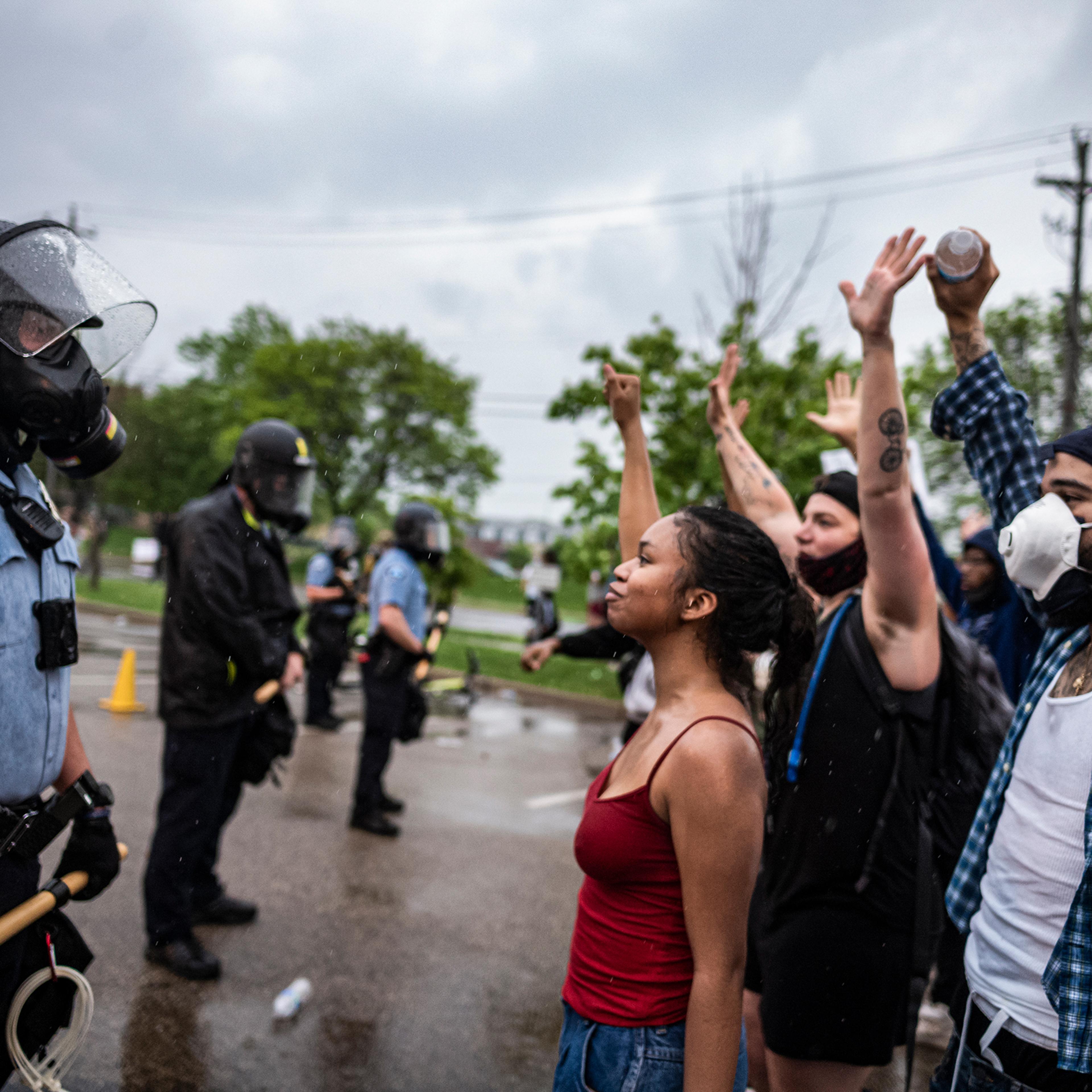 Protesters face off with police in Minneapolis on May 26 after video footage from a day earlier surfaced showing a white officer kneeling on the neck of a handcuffed black man—identified as George Floyd by an attorney for his family—despite saying he cou