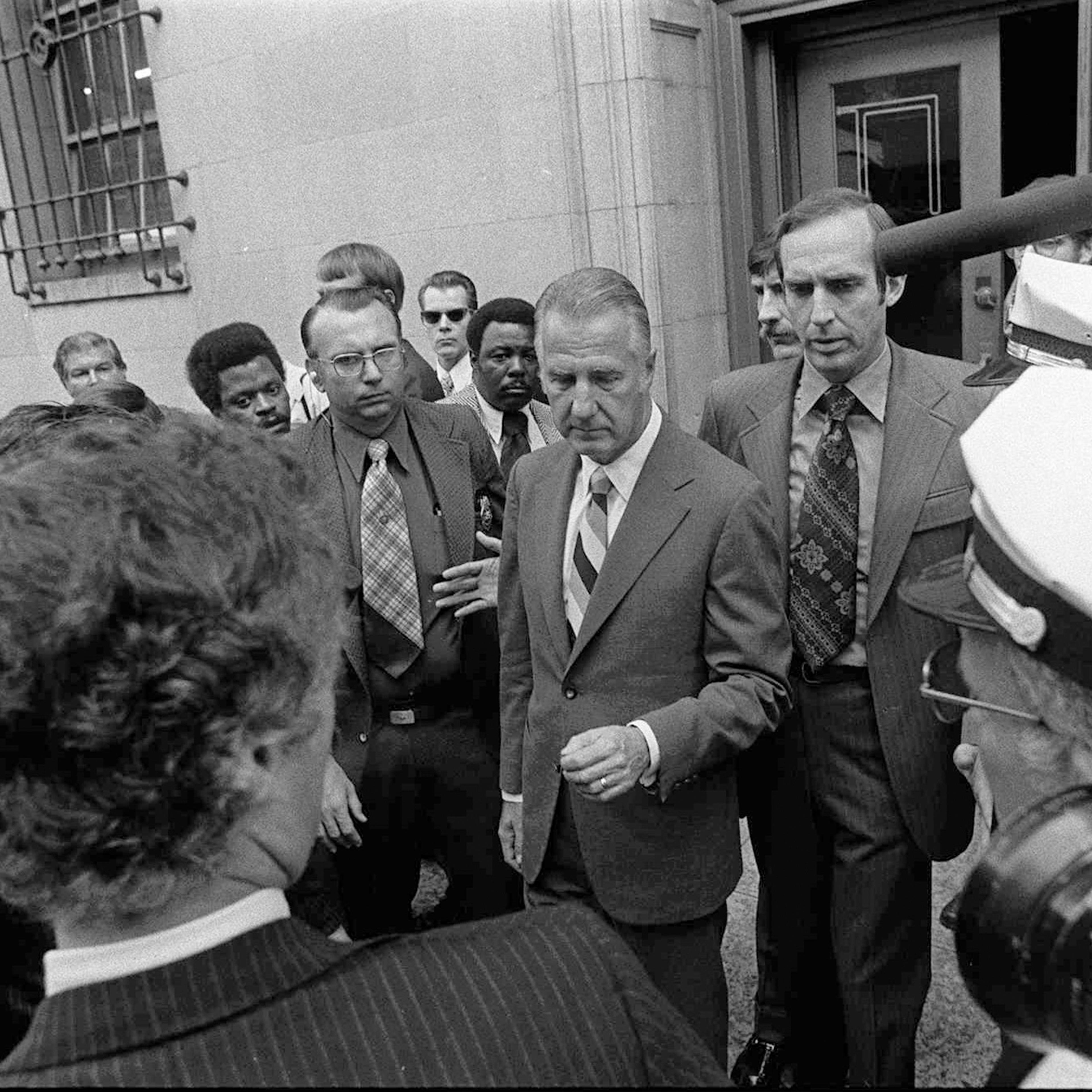 Spiro T. Agnew, center, is shown leaving court in Baltimore Oct. 10, 1973 after pleading no contest to a charge of income tax evasion. Agnew resigned from the Vice Presidency shortly after.