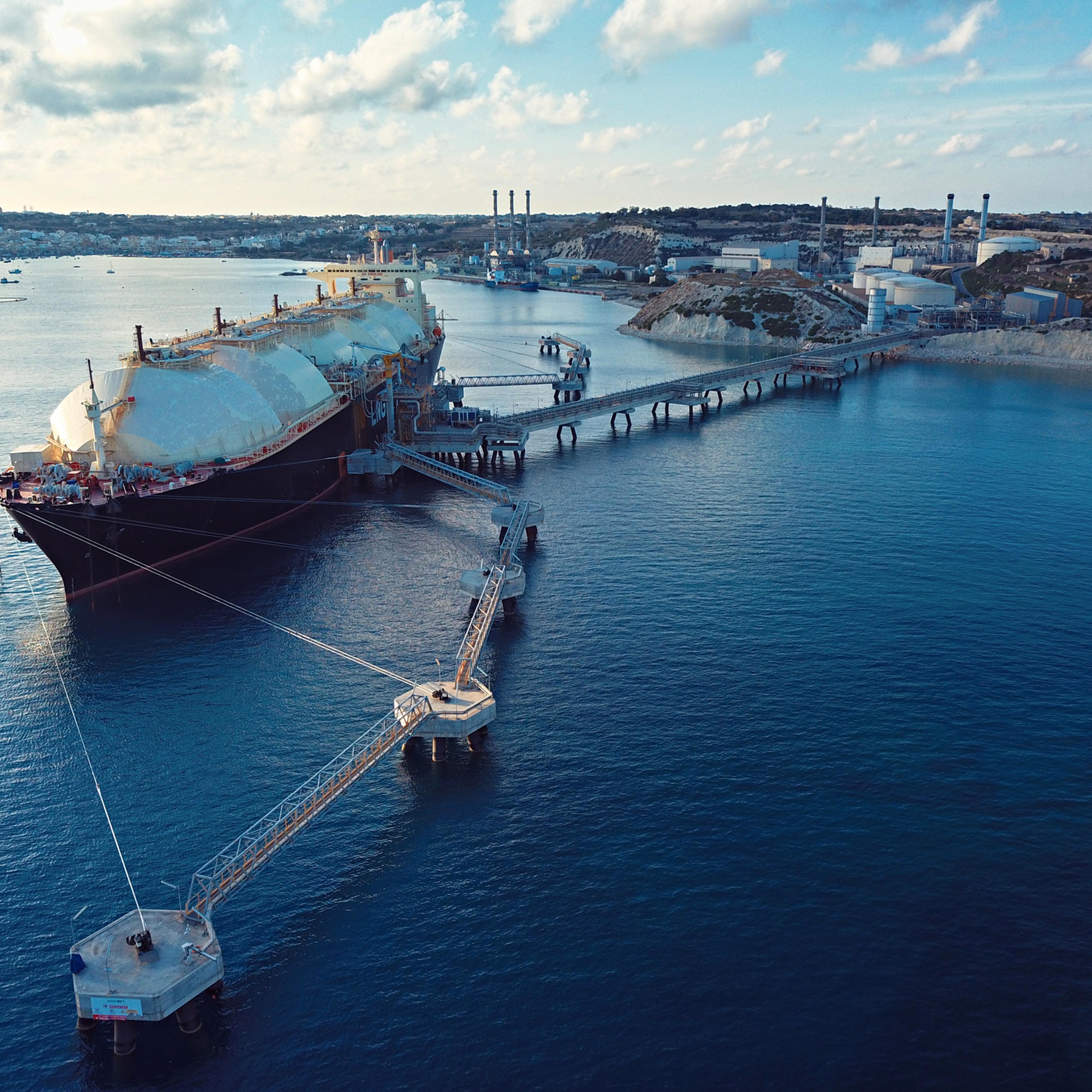 Aerial View Of A Liquefied Natural Gas (LNG) Tanker Moored To The Jetty