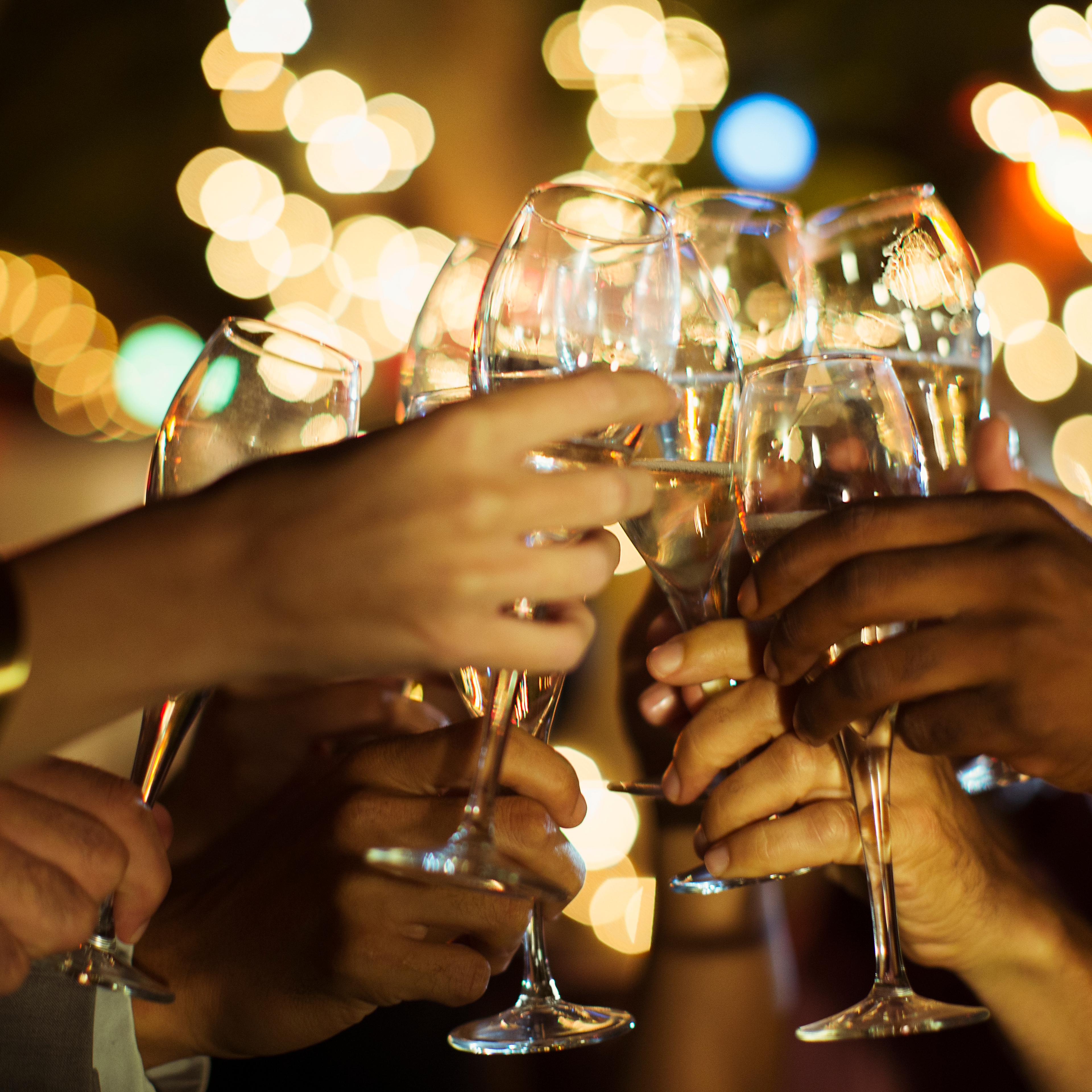 Friends toasting each other at party