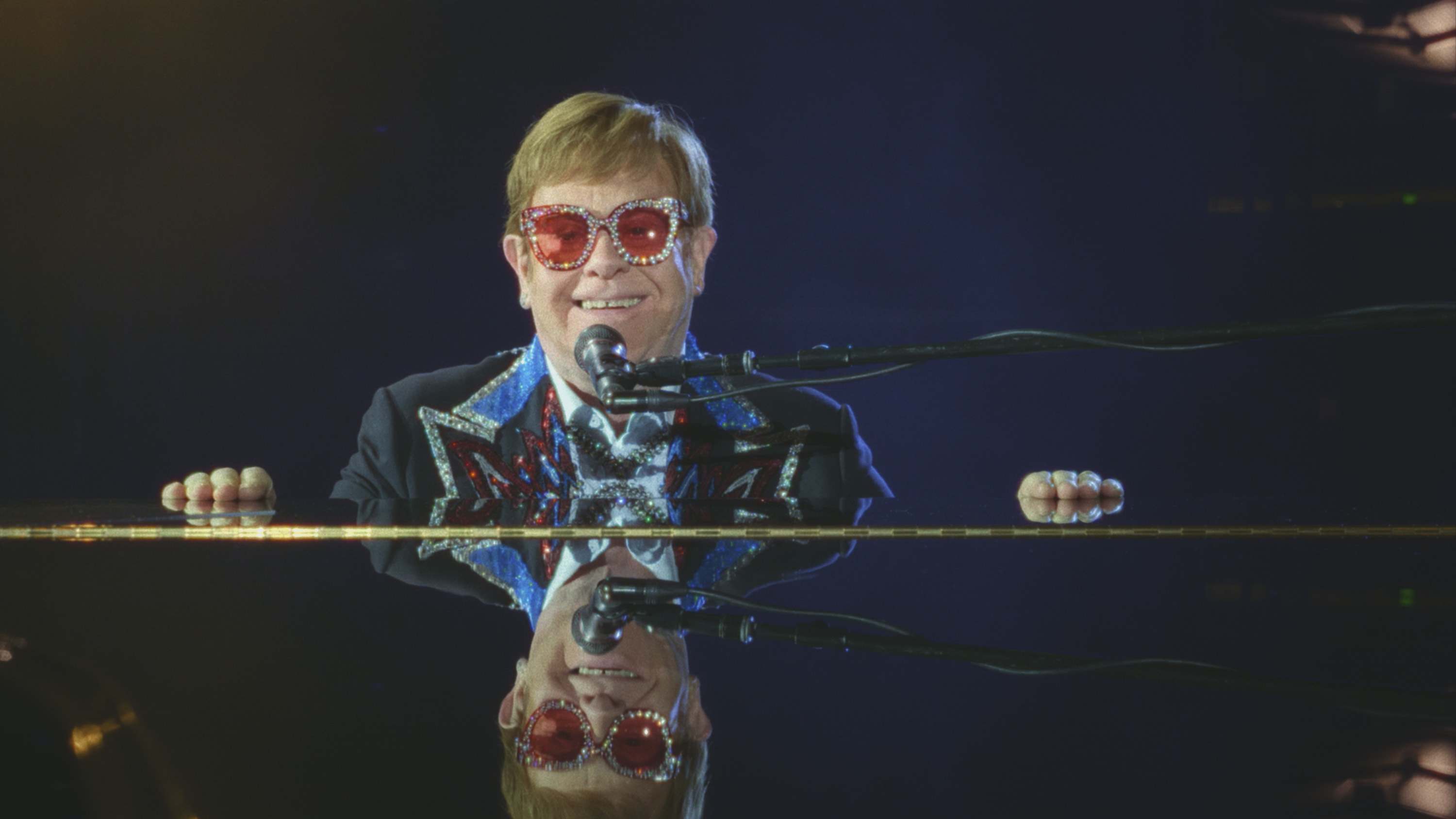 A scene from the Elton John doc on Disney of Elton John at his final concert performance at Dodger Stadium in 2022