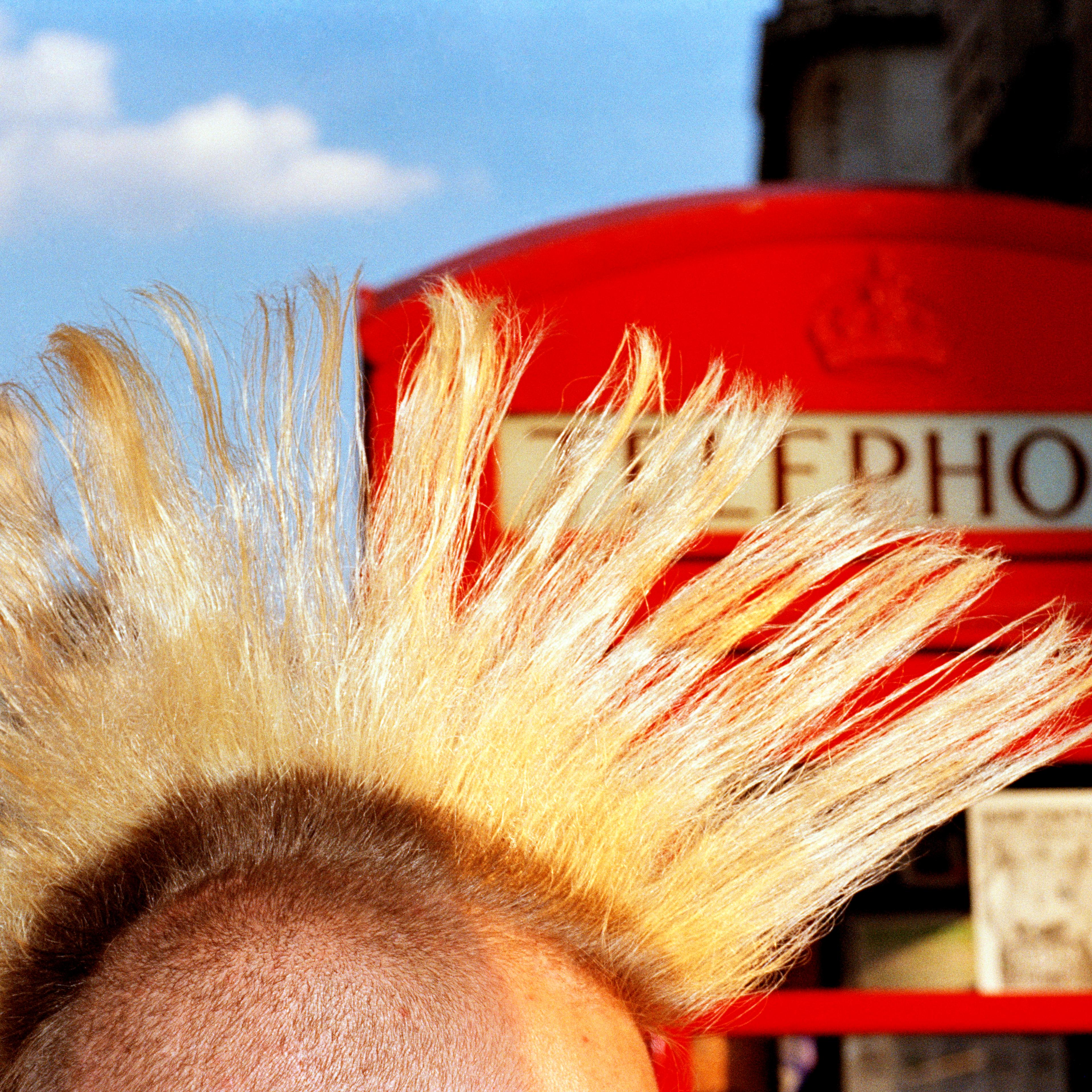 1997. Some punks kept their Mohican haircuts and lived by charging tourists money to photograph them (often by a red bus or telephone box).