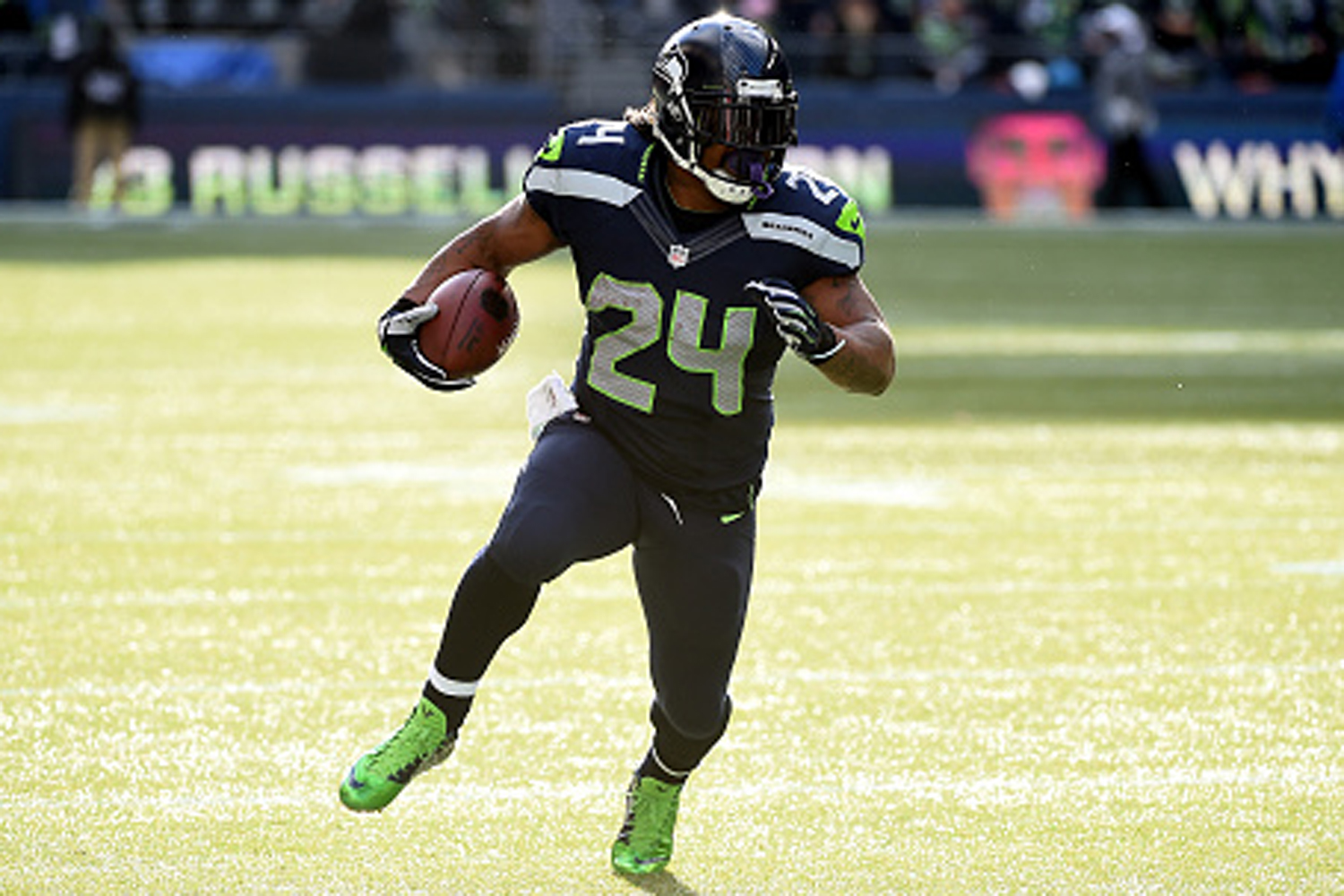 Marshawn Lynch #24 of the Seattle Seahawks runs the ball in the first quarter against the Arizona Cardinals during their game at CenturyLink Field on November 23, 2014, in Seattle, Washington. 