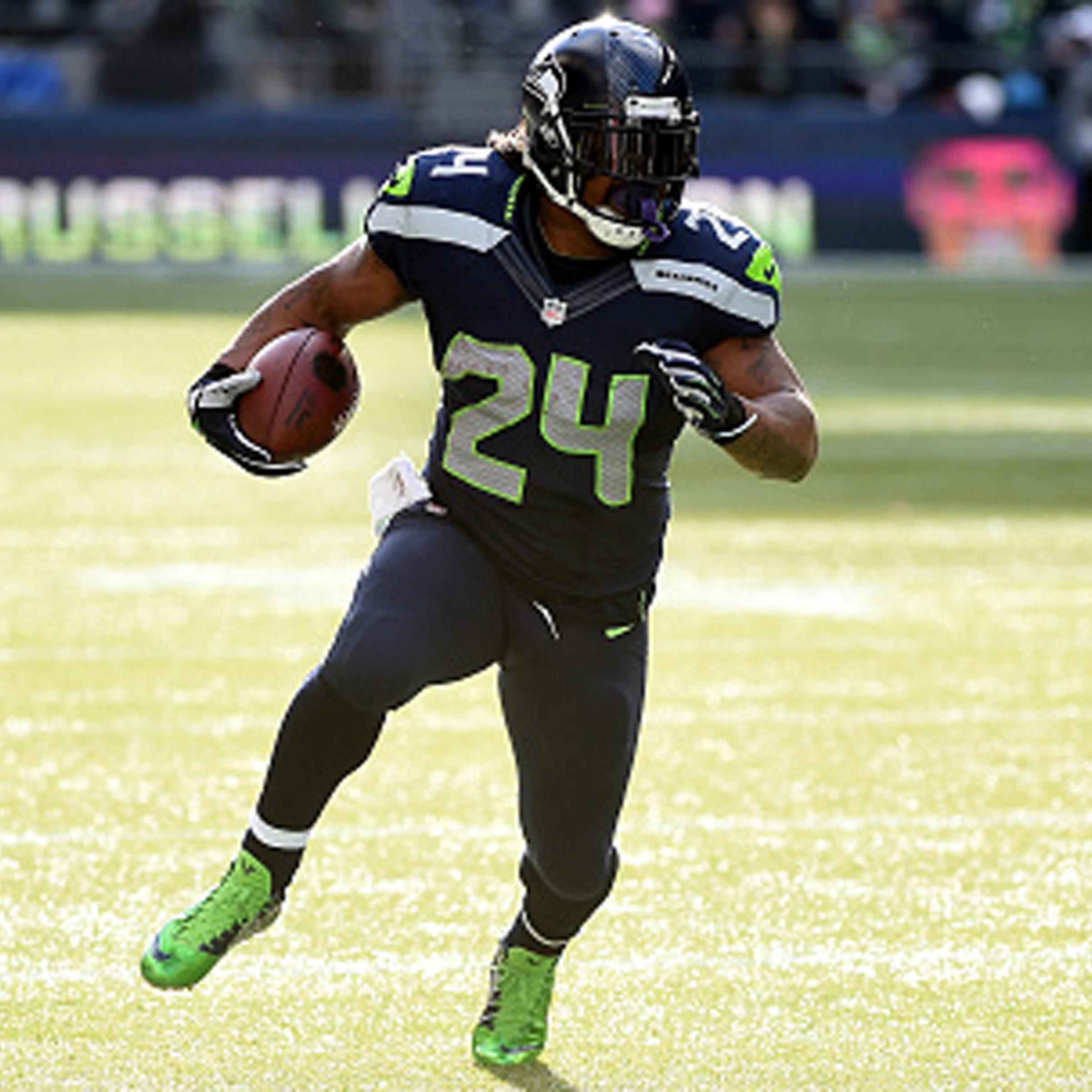 Marshawn Lynch #24 of the Seattle Seahawks runs the ball in the first quarter against the Arizona Cardinals during their game at CenturyLink Field on November 23, 2014, in Seattle, Washington.