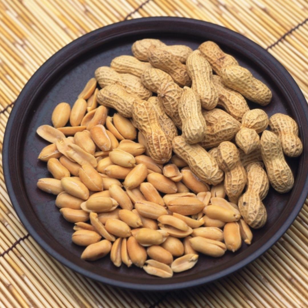 Closed Up Image of a Black-colored Plate Filled With Peanuts.