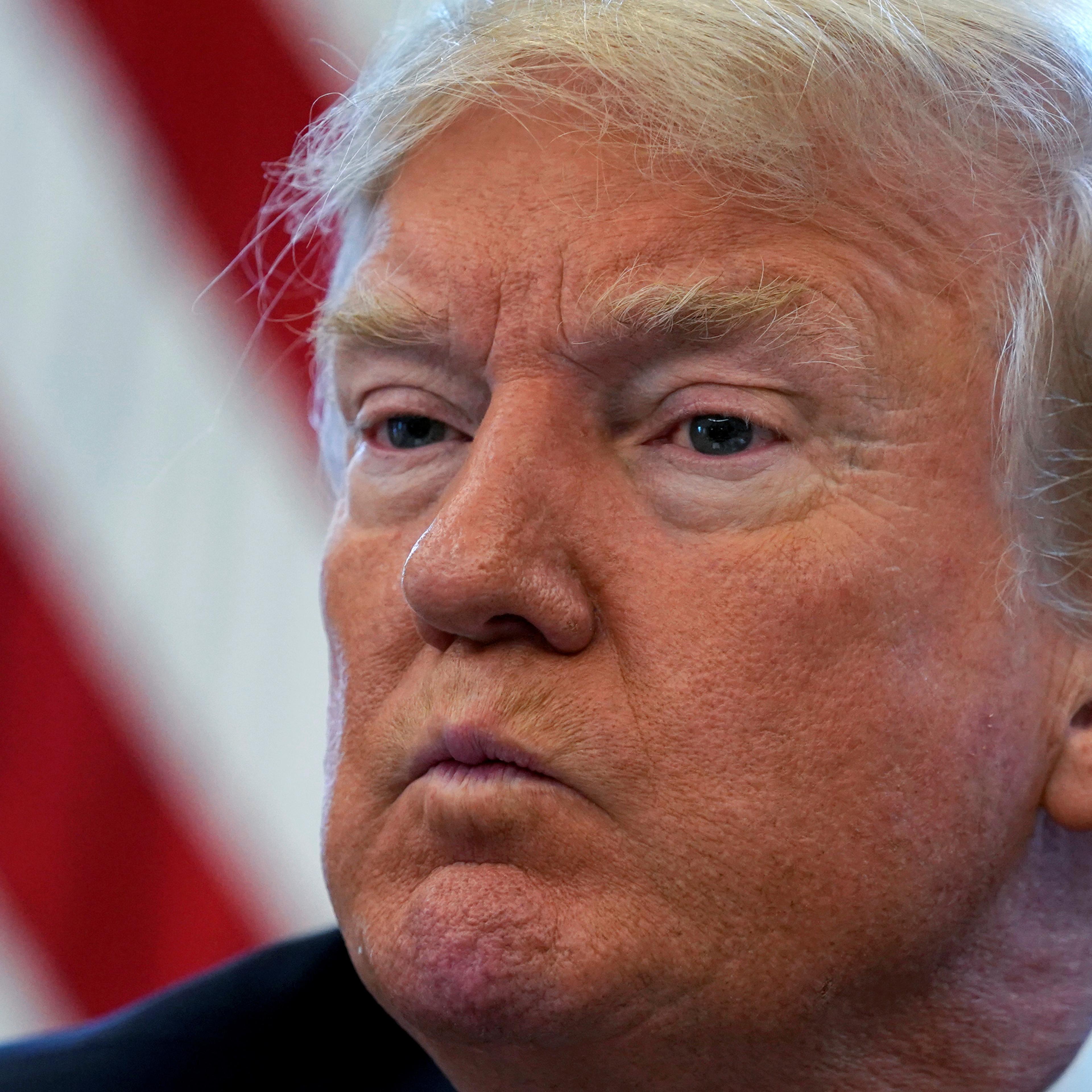 U.S. President Donald Trump pauses during an interview with Reuters in Washington
