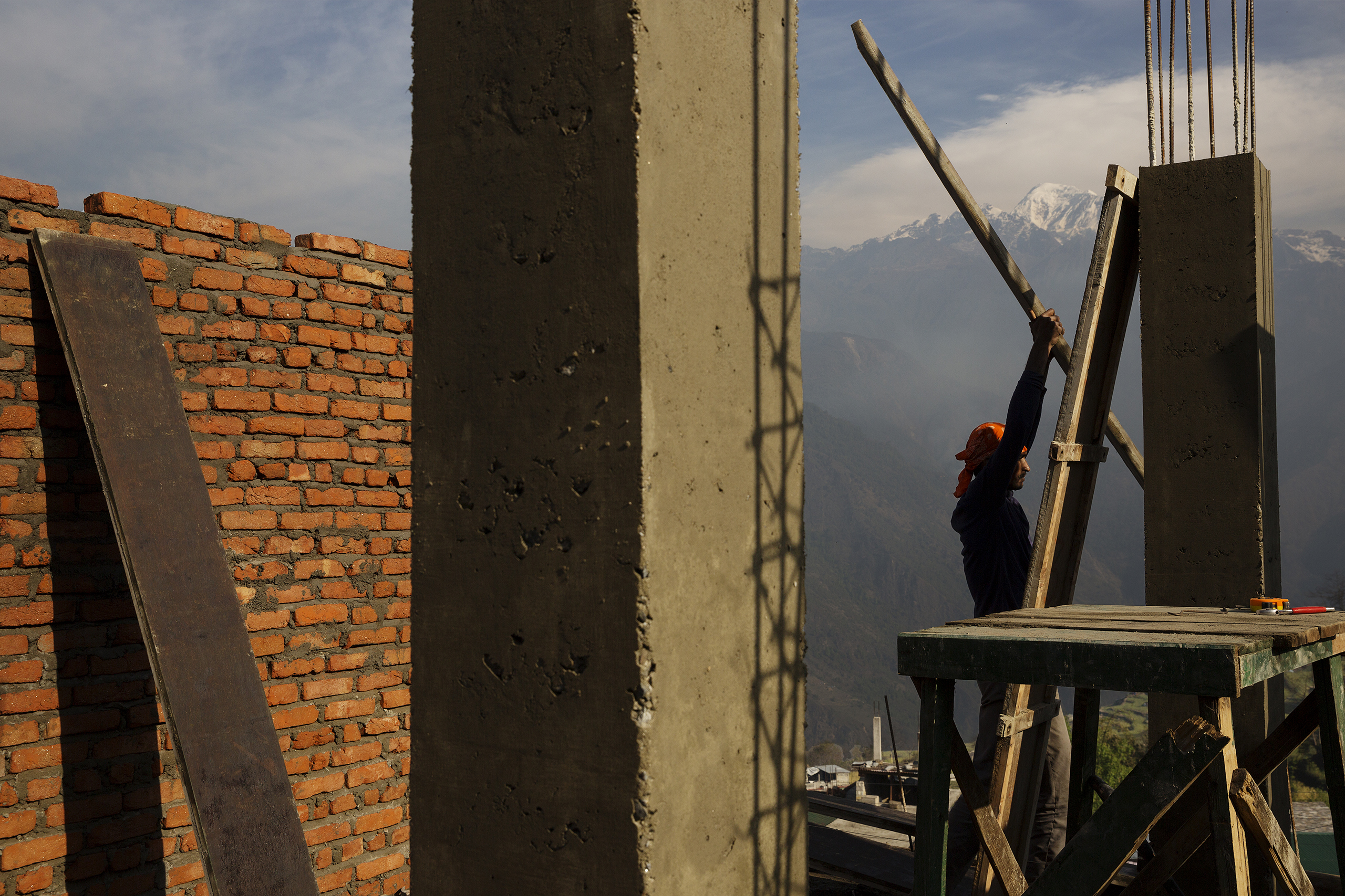 Villagers rebuild houses in Barpak, in Gorkha district, at the epicenter of the 2015 earthquakes. In the immediate aftermath of the disaster, landslides left Barpak and other remote villages cut-off from the rest of Nepal. Entire communities were rendere