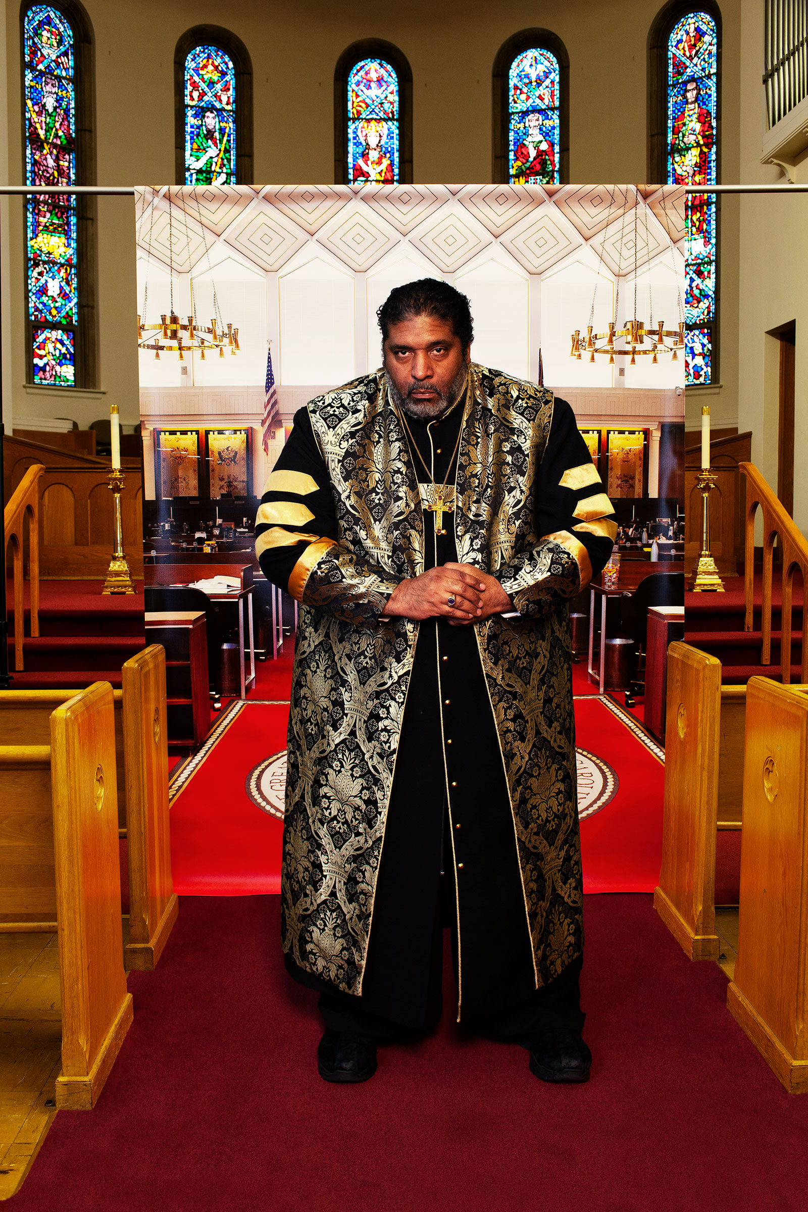 Barber at Pullen Memorial Baptist Church in Raleigh, N.C., on Jan. 27, before a backdrop showing the North Carolina house of representatives chamber where he was arrested in 2011