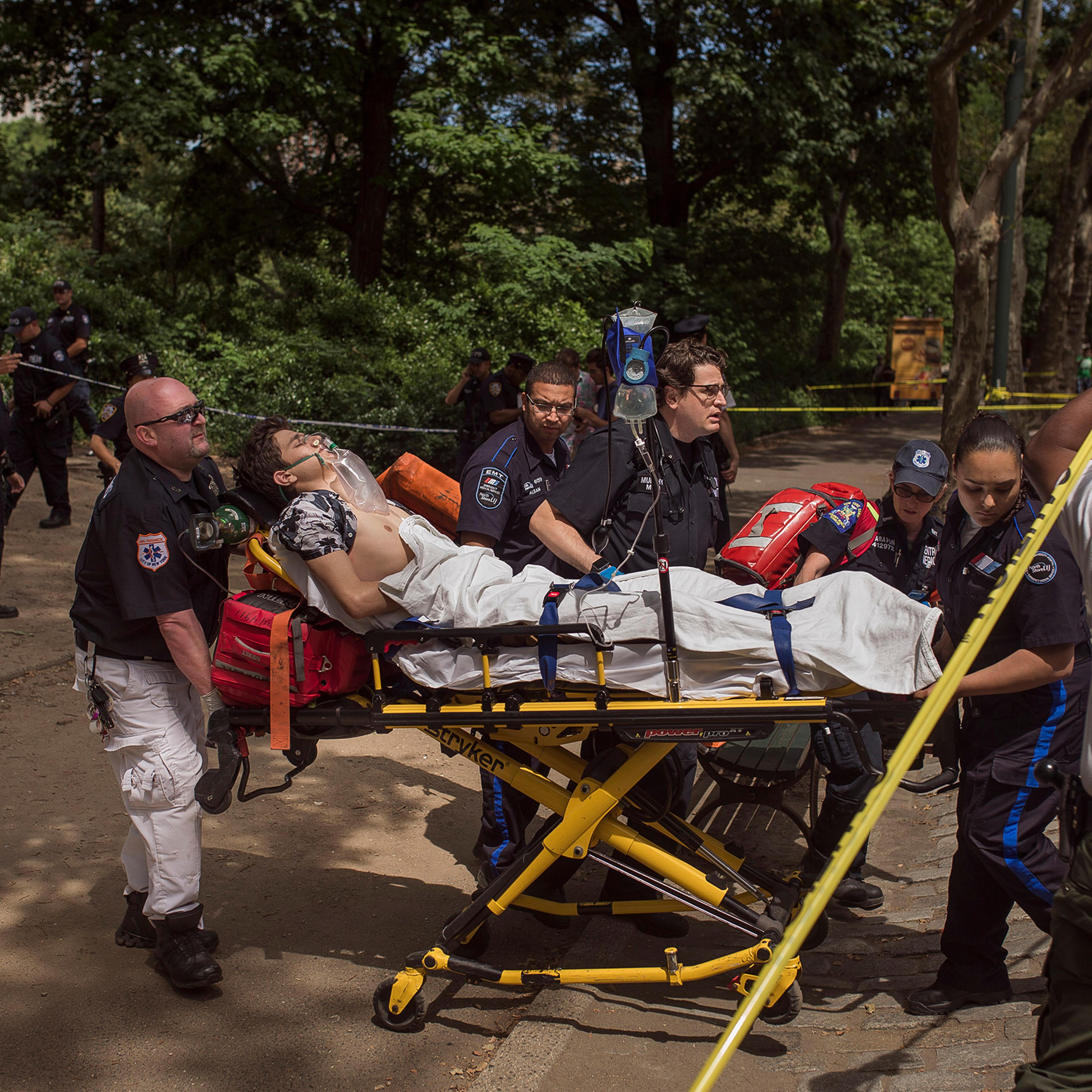 A injured man is carried to an ambulance in Central Park in New York City on July 3, 2016.