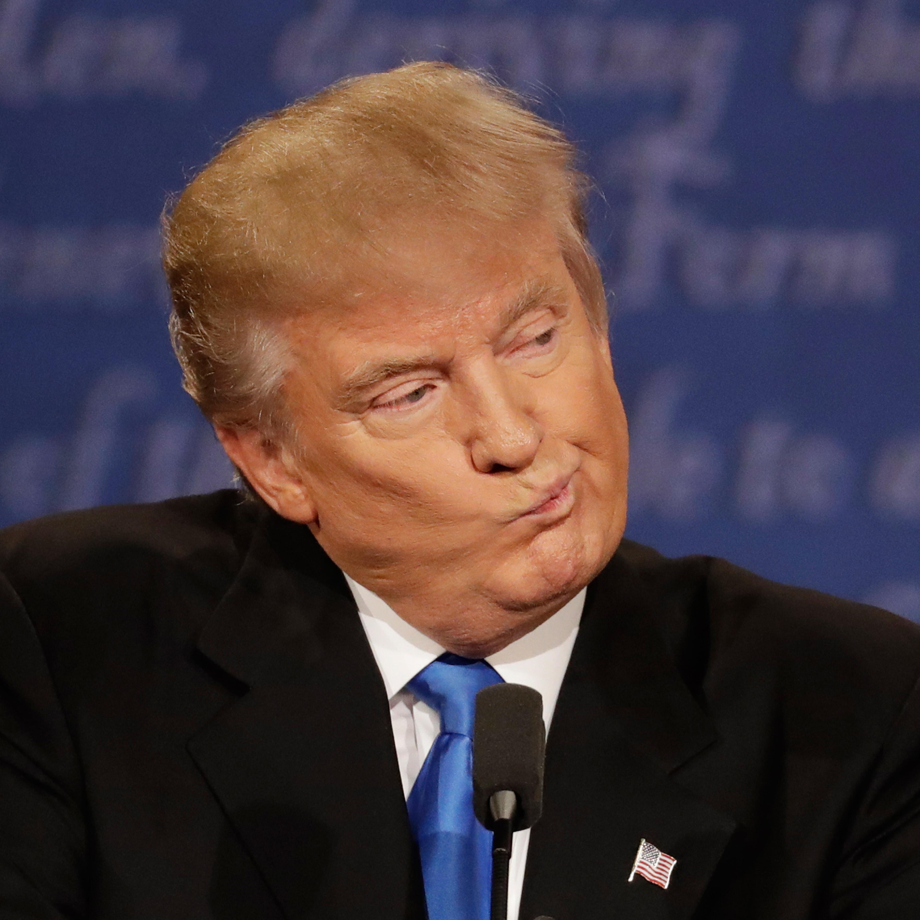 Republican presidential nominee Donald Trump listens to Democratic presidential nominee Hillary Clinton during the presidential debate at Hofstra University in Hempstead, N.Y., Monday, Sept. 26, 2016. (AP Photo/Patrick Semansky)