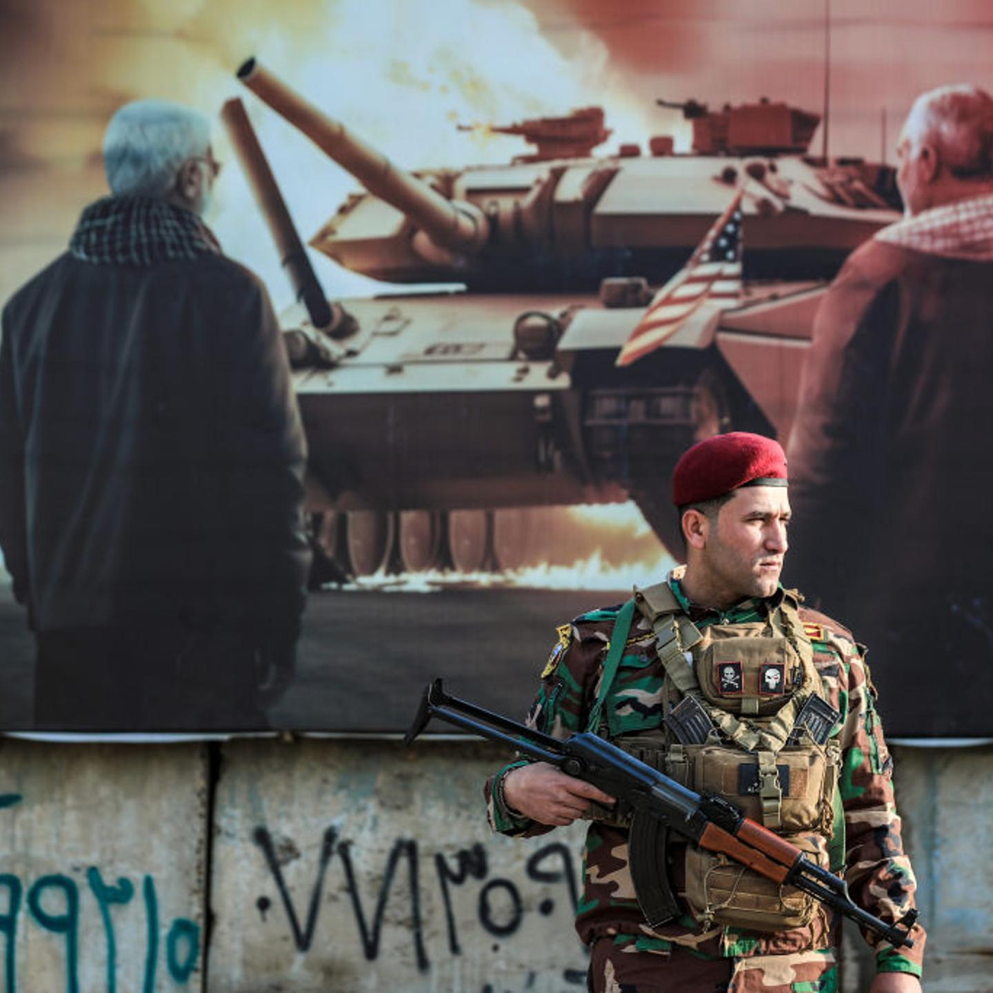 A member of the Iraqi's Popular Mobilization Forces (Hashed al-Shaabi) stands guard on Feb. 4, 2024 during the funeral of the 16 members killed in U.S. airstrikes.