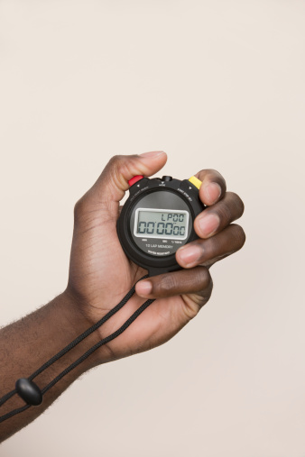 hand-holding-digital-stopwatch