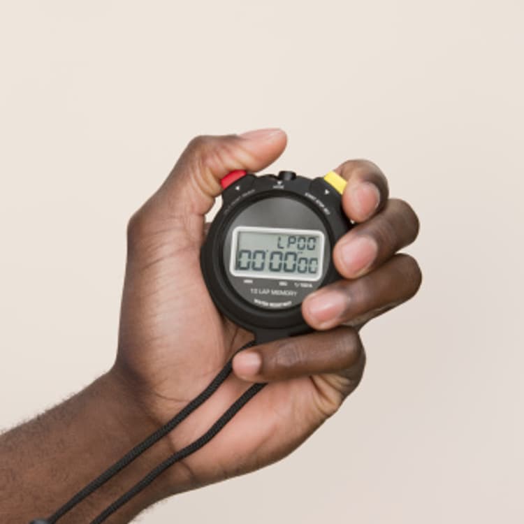 hand-holding-digital-stopwatch
