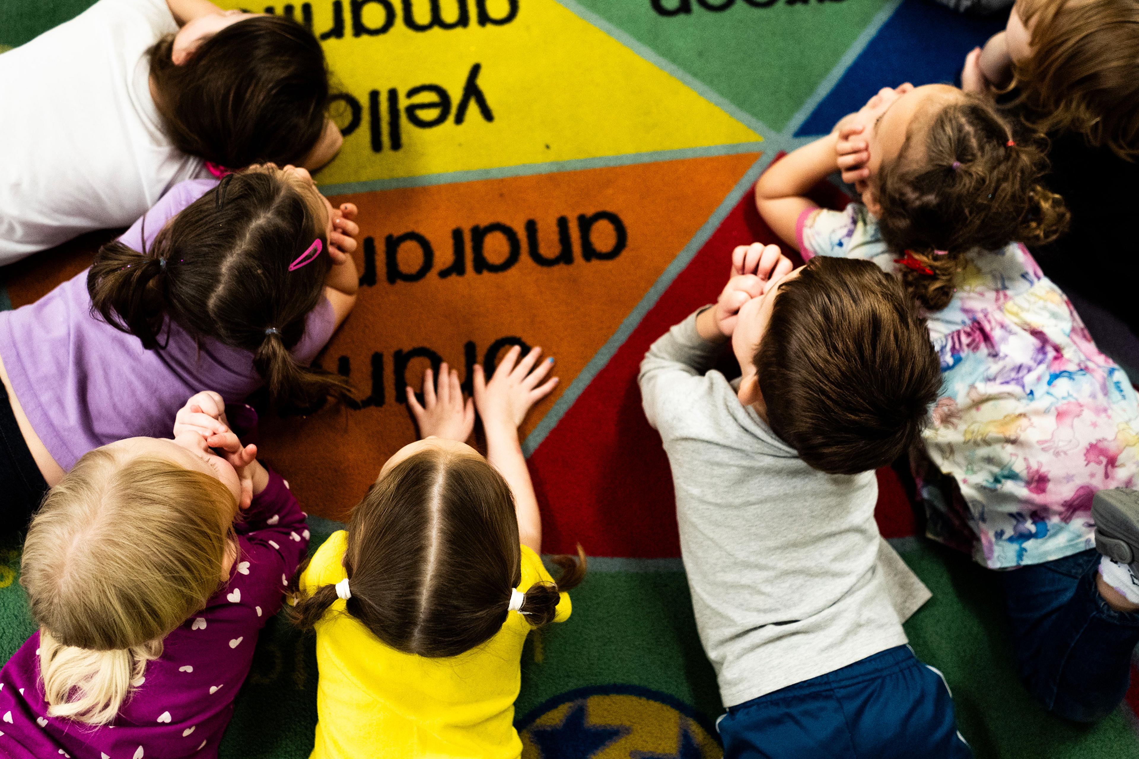 Children listen to a story at TLC for Tots daycare center in Nampa, Idaho on Nov. 20, 2024.