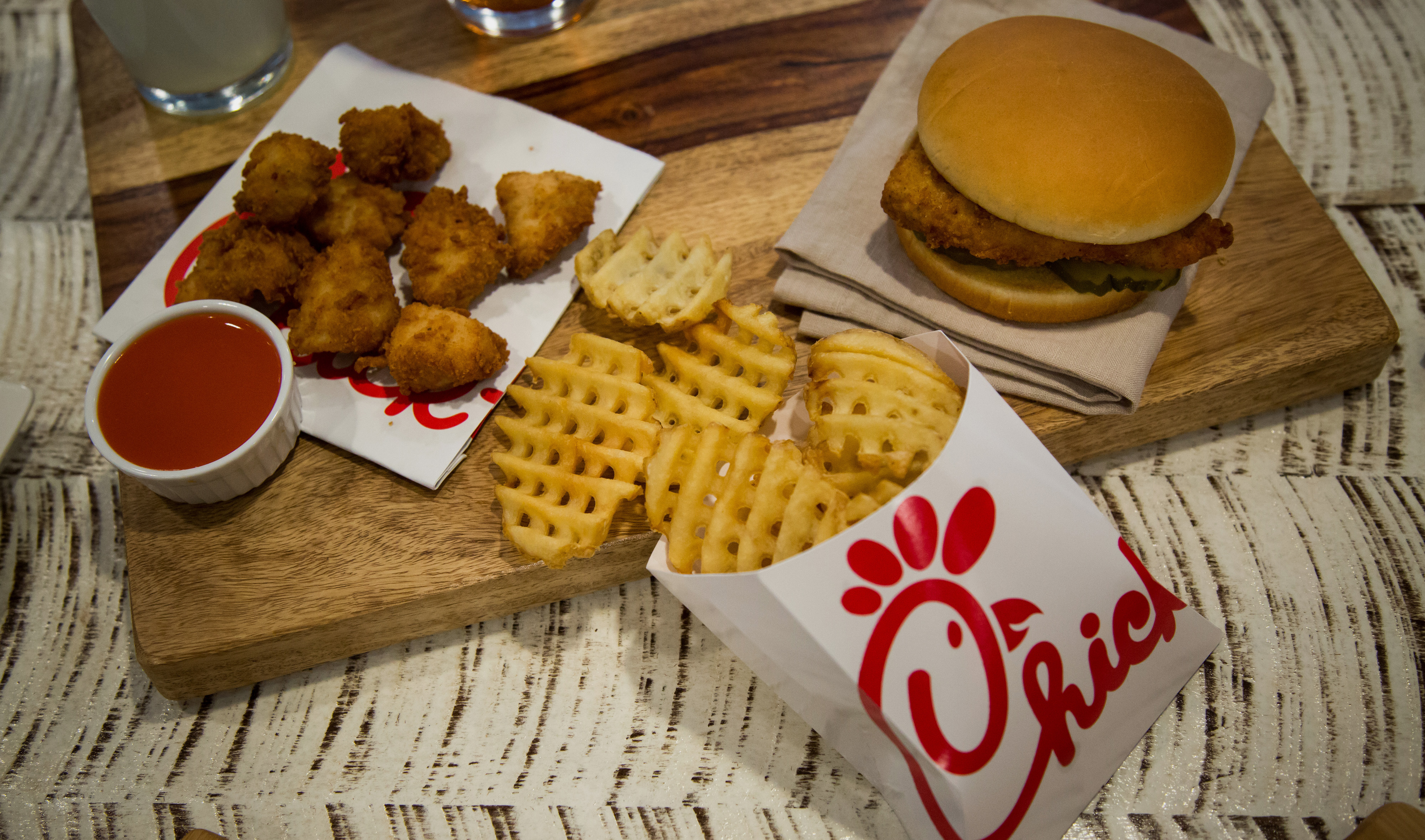 Chicken nuggets, french fries, and a fried chicken sandwich are arranged for a photograph during an event ahead of the grand opening for a Chick-fil-A restaurant in New York, U.S., on Friday, Oct. 2, 2015.