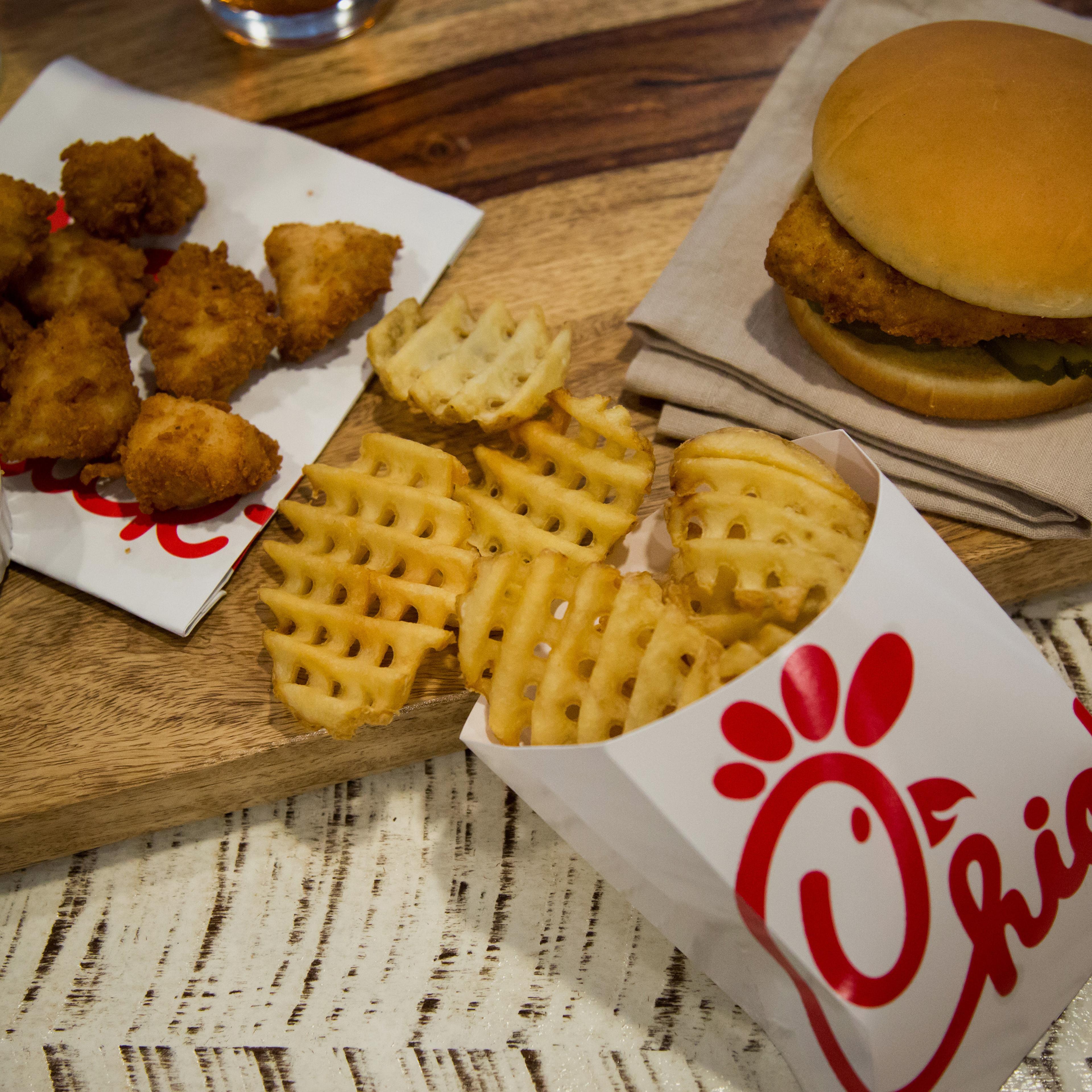 Chicken nuggets, french fries, and a fried chicken sandwich are arranged for a photograph during an event ahead of the grand opening for a Chick-fil-A restaurant in New York, U.S., on Friday, Oct. 2, 2015.