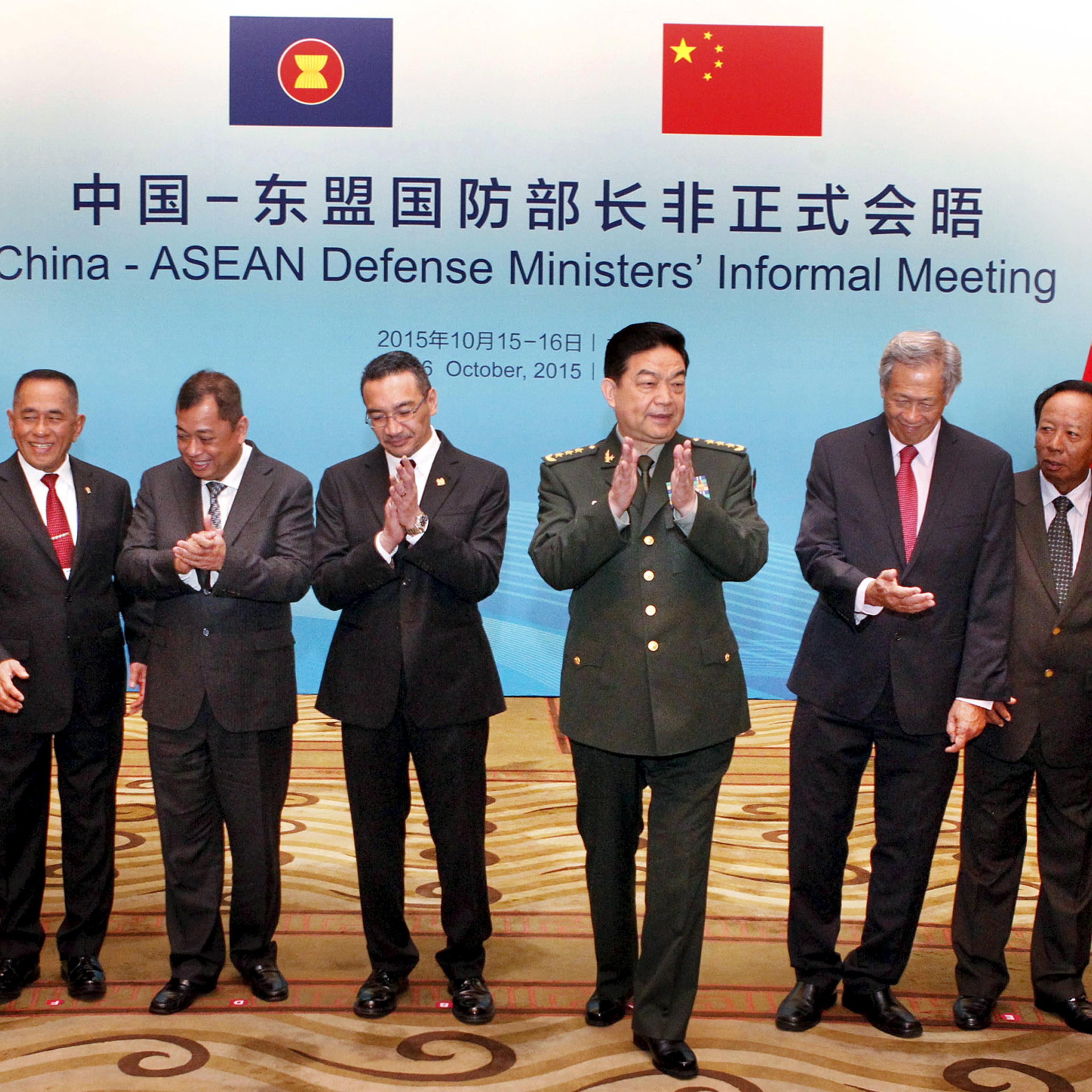 Chinese Defence Minister Chang claps next to his counterparts from South East Asian Nations (ASEAN) during the China-ASEAN Defense Ministers' Informal Meeting in Beijing