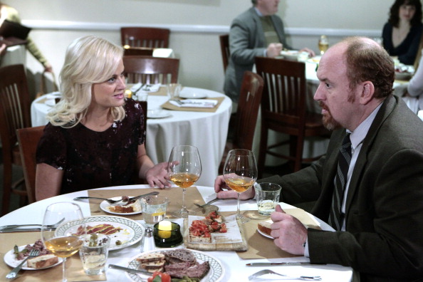 Amy Poehler as Leslie Knope and Louis C.K. as Dave Sanderson in Parks and Recreation