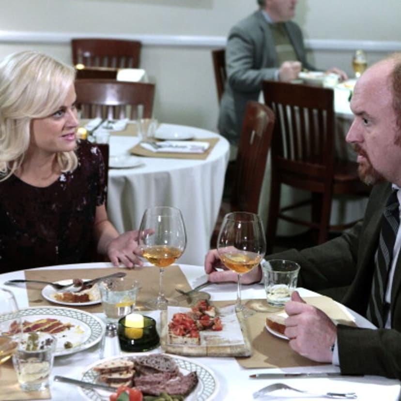 Amy Poehler as Leslie Knope and Louis C.K. as Dave Sanderson in Parks and Recreation