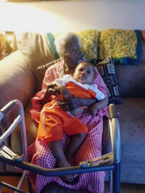 Talley holds great-great grandson Armmell Holloway at home, May 13, 2014.