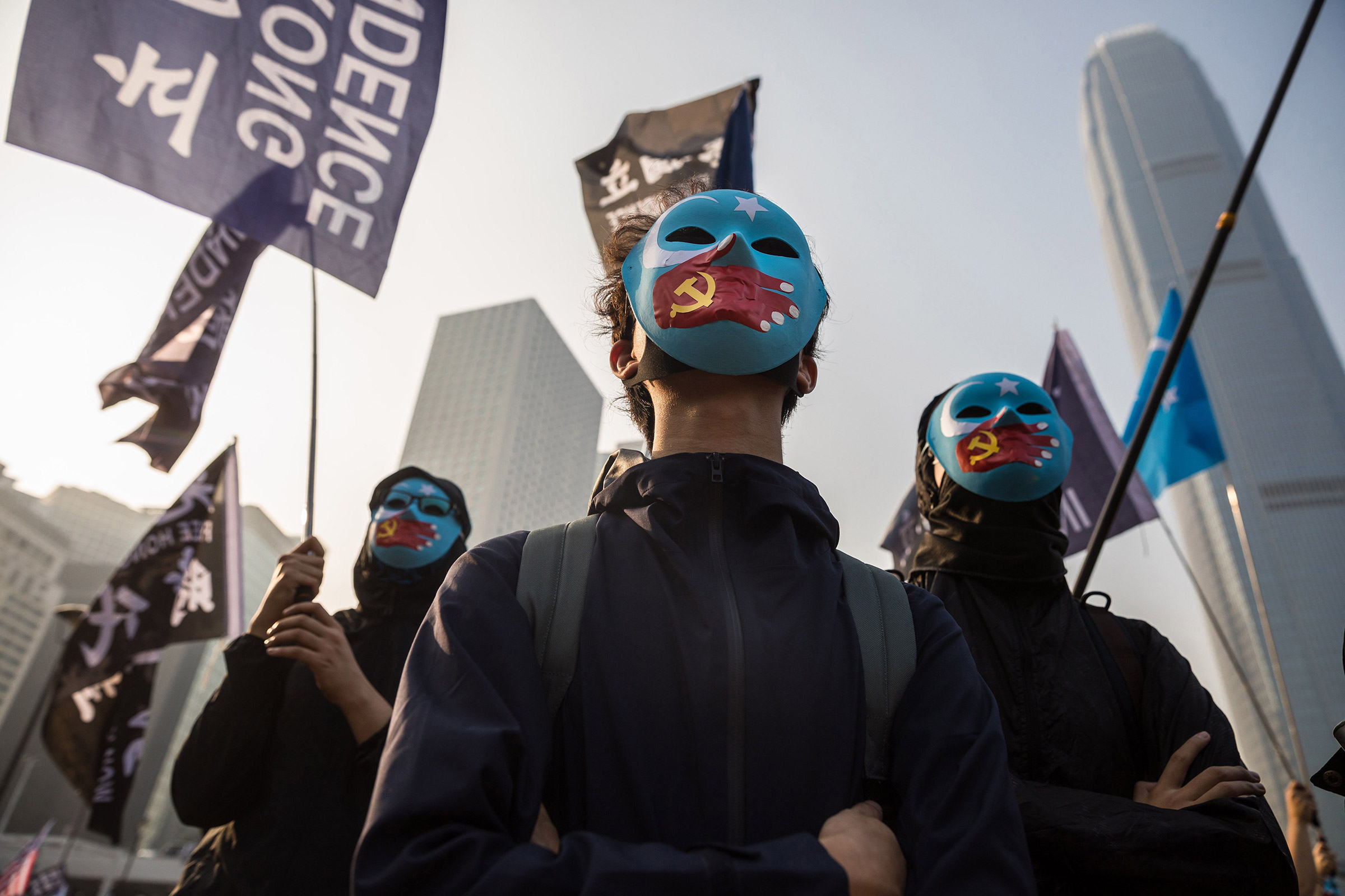 Protesters attend a rally in Hong Kong to show support for the Uighur minority in China