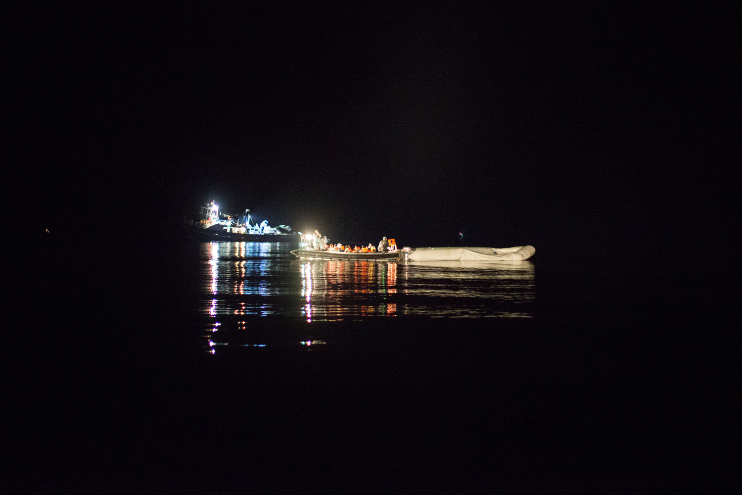 African refugees rescued by the Italian navy at night off a rubber dinghy, June 8.