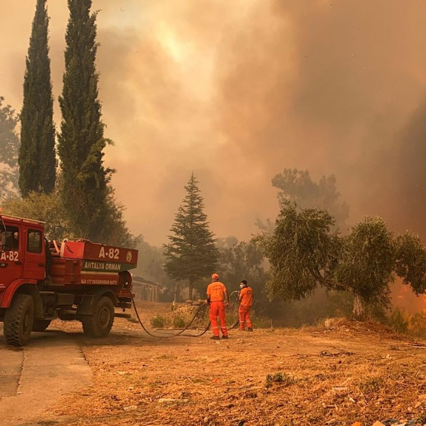 A firefighter battles with fire during a massive wildfire which engulfed a Mediterranean resort region on Turkey's southern coast near the town of Manavgat, on July 29, 2021.
