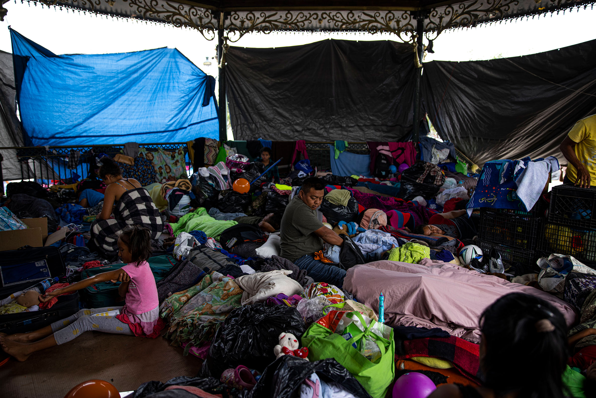 Migrants take refuge in a gazebo in Reynosa, Tamaulipas, Mexico on May 6, 2021. Hundreds of migrants have begun living in shelters and a makeshift tent encampment in Reynosa as a result of Title 42, a Trump-era policy that has remained in place under the Biden Administration and allows the government to immediately “expel” anyone who attempts to enter the U.S., even if they wish to make a claim for asylum, because of the risks posed by COVID-19.
