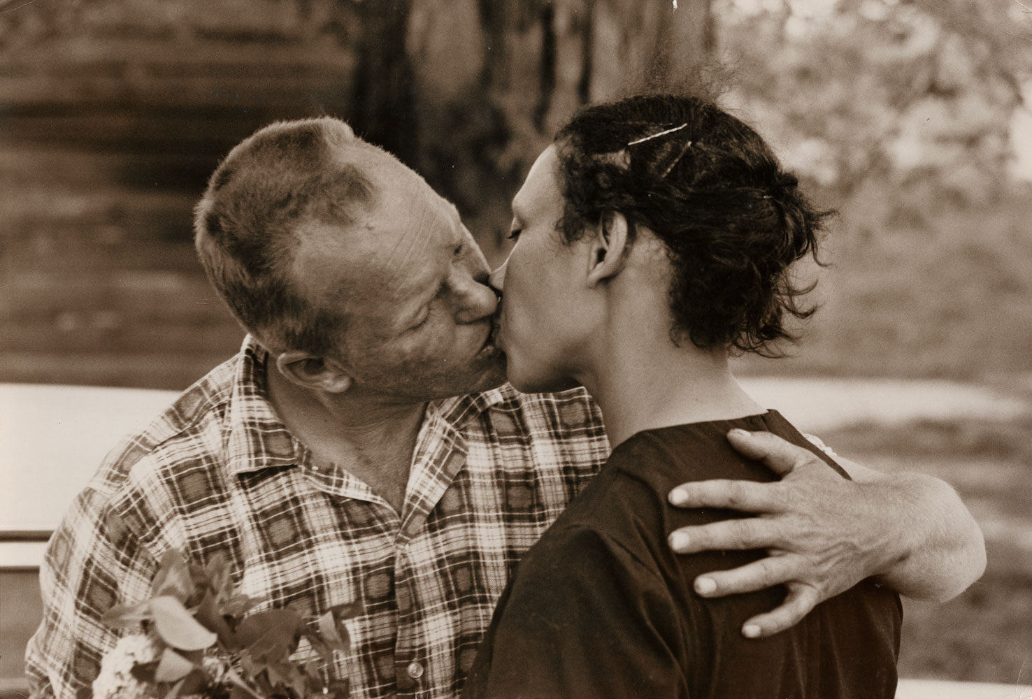 Richard Loving kissing wife Mildred as he arrives home from work, King and Queen County, Virginia, April 1965.