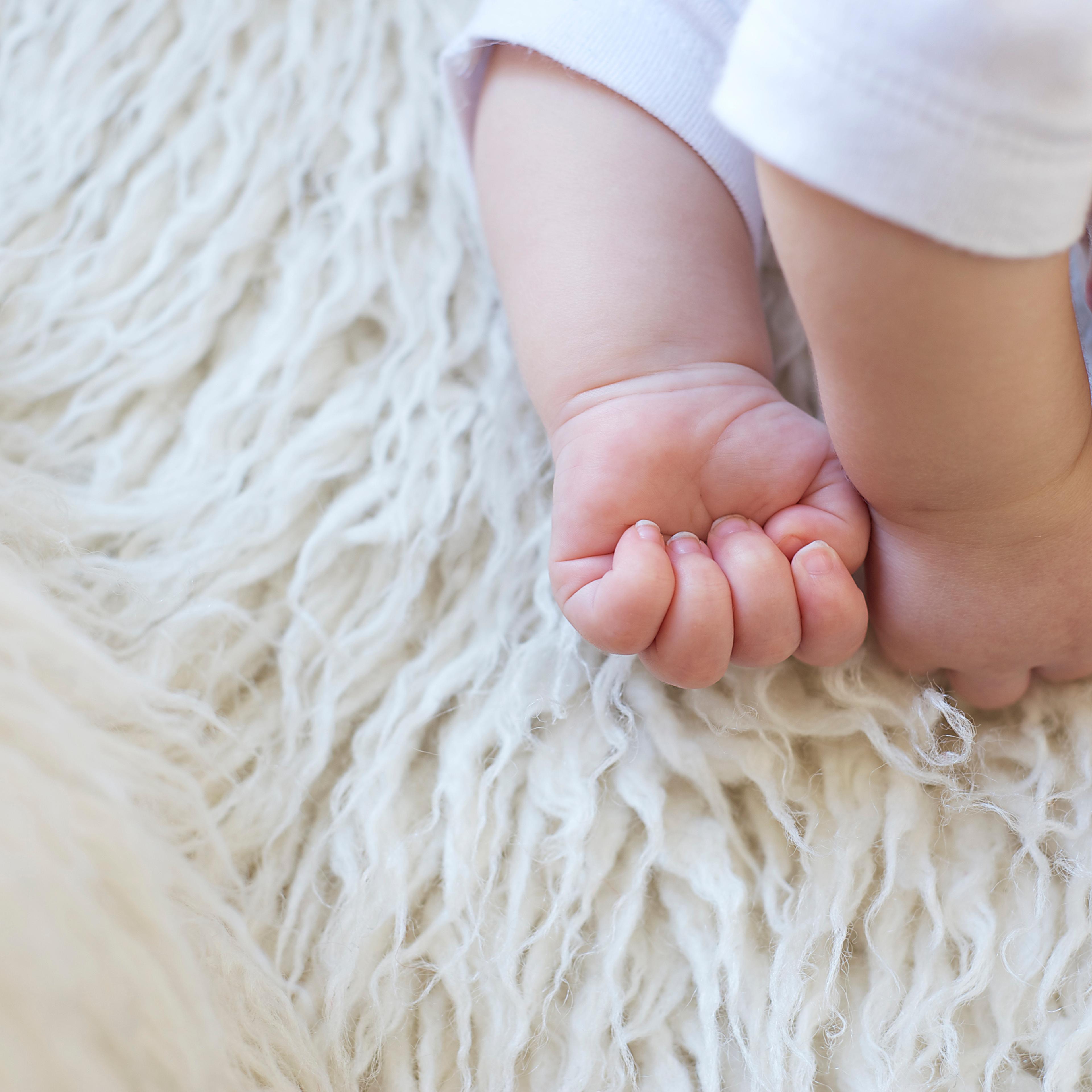 Baby on fur rug